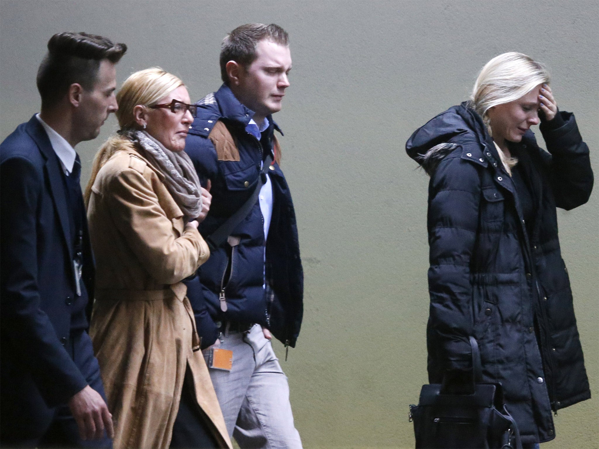 Relatives arrive at Dusseldorf airport on Tuesday