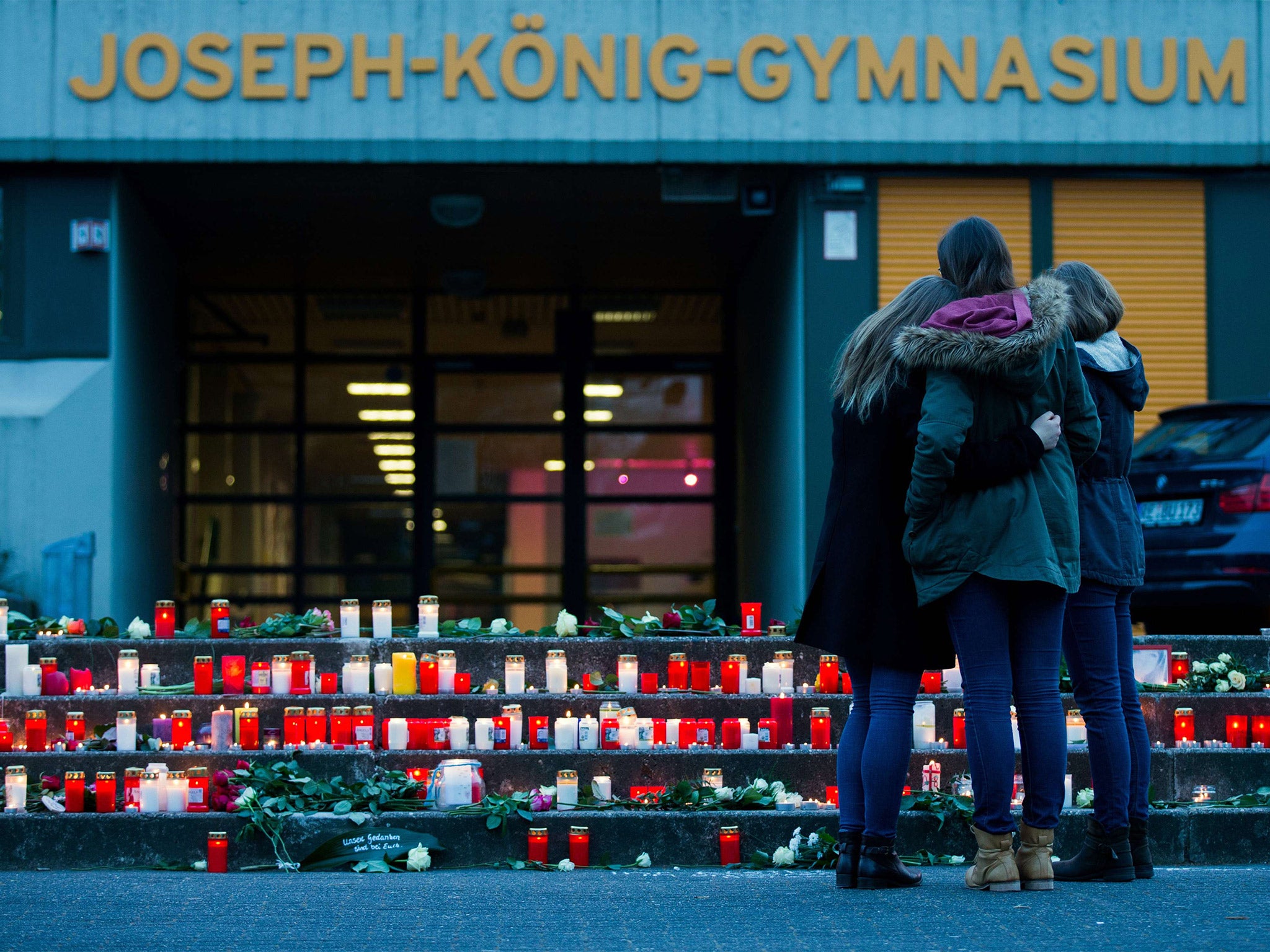 Students gather in front of the Josef-König secondary school in Haltern am See, western Germany, where some of the Germanwings plane crash victims studied (Getty)