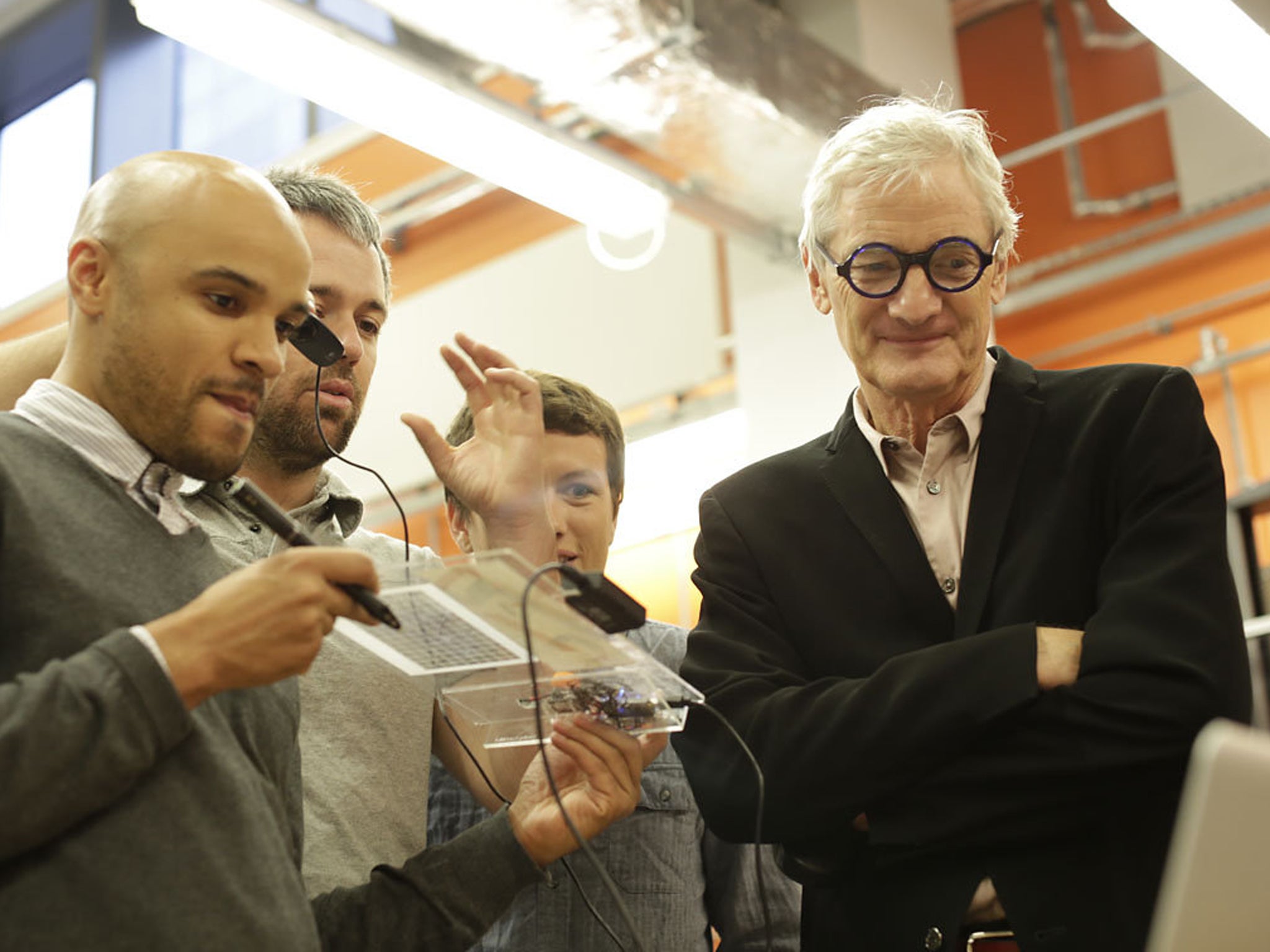 Imperial College students show off prototypes to James Dyson