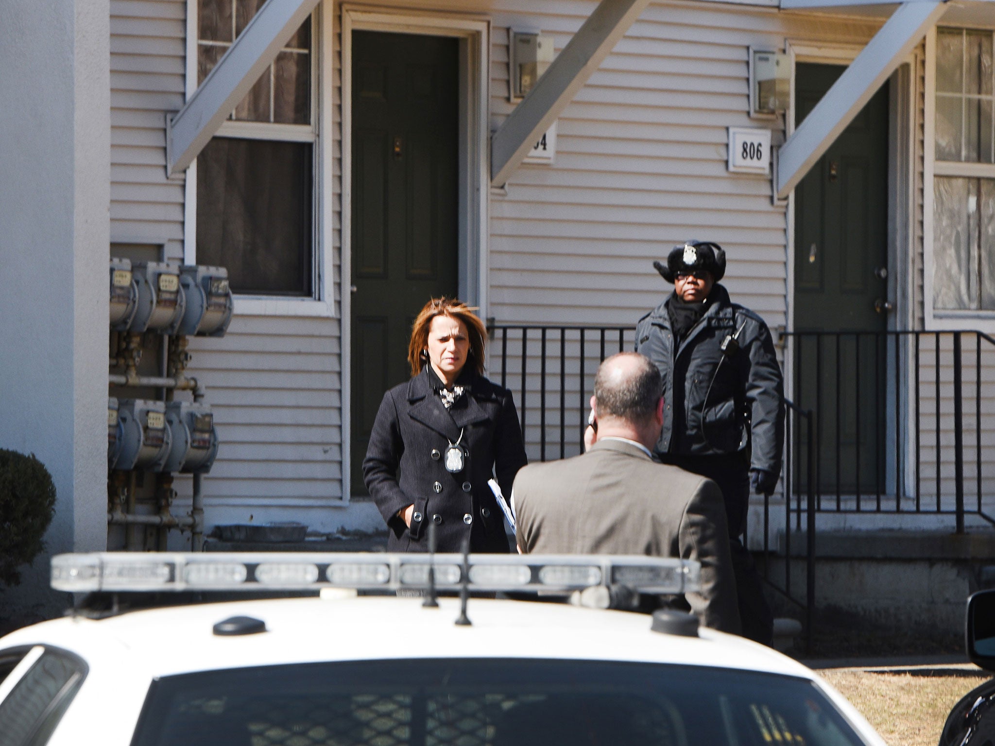 Police investigate an apartment complex in Detroit where the bodies of two children were found in a freezer