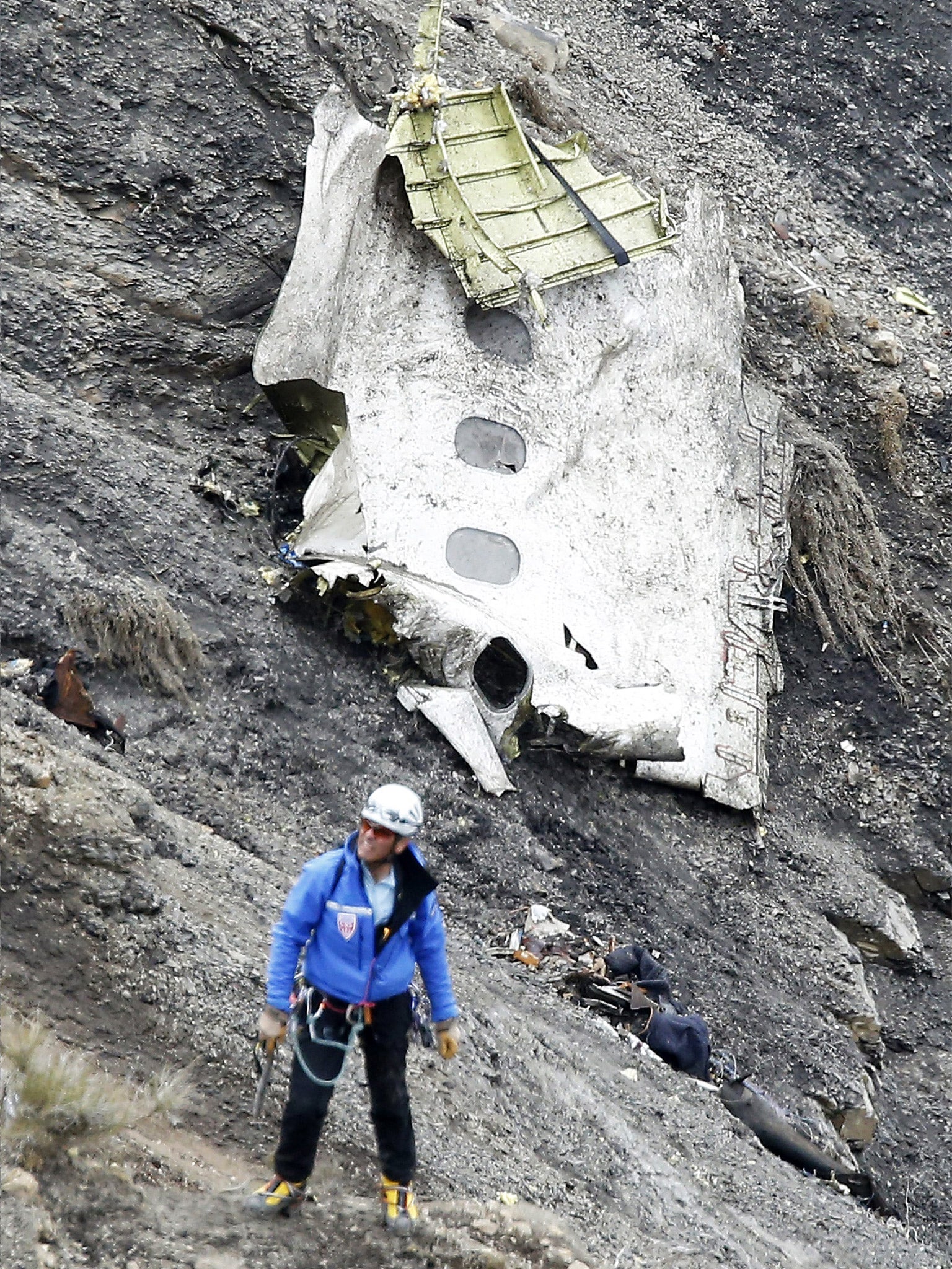 A search and rescue worker at the crash site