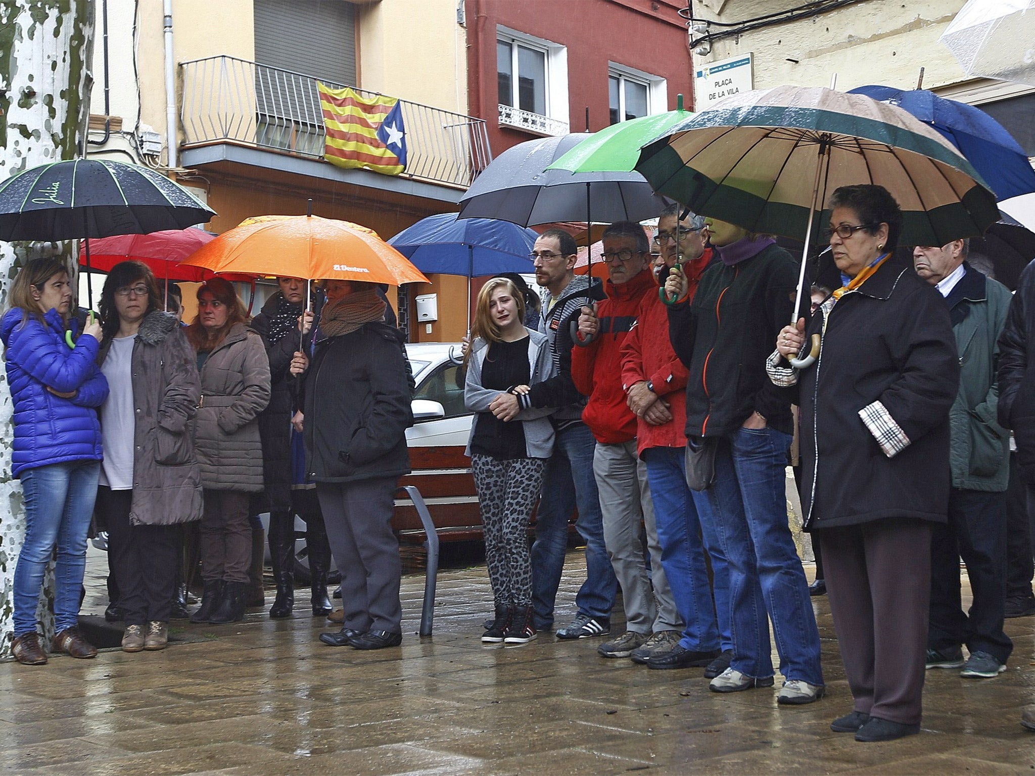 Residents of Llinars del Vallès observe a minute of silence to honour the victims of the crash (Getty)