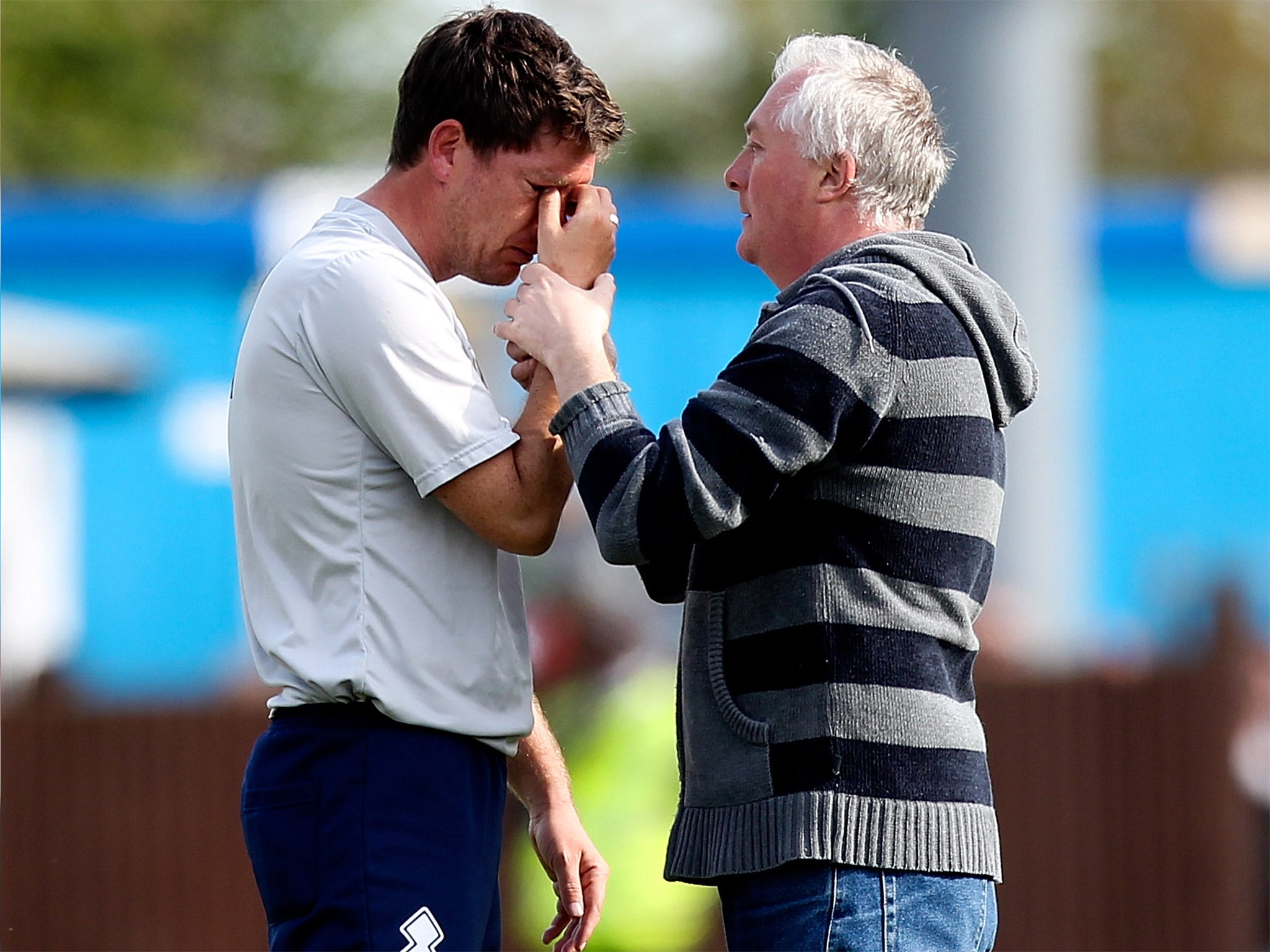 Darrell Clarke is consoled after Bristol Rovers are relegated from League Two last May