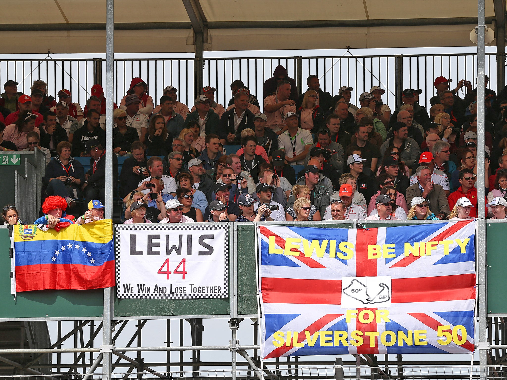 Fans of Lewis Hamilton watch their hero on his way to victory at the British Grand Prix at Silverstone last year (Getty)