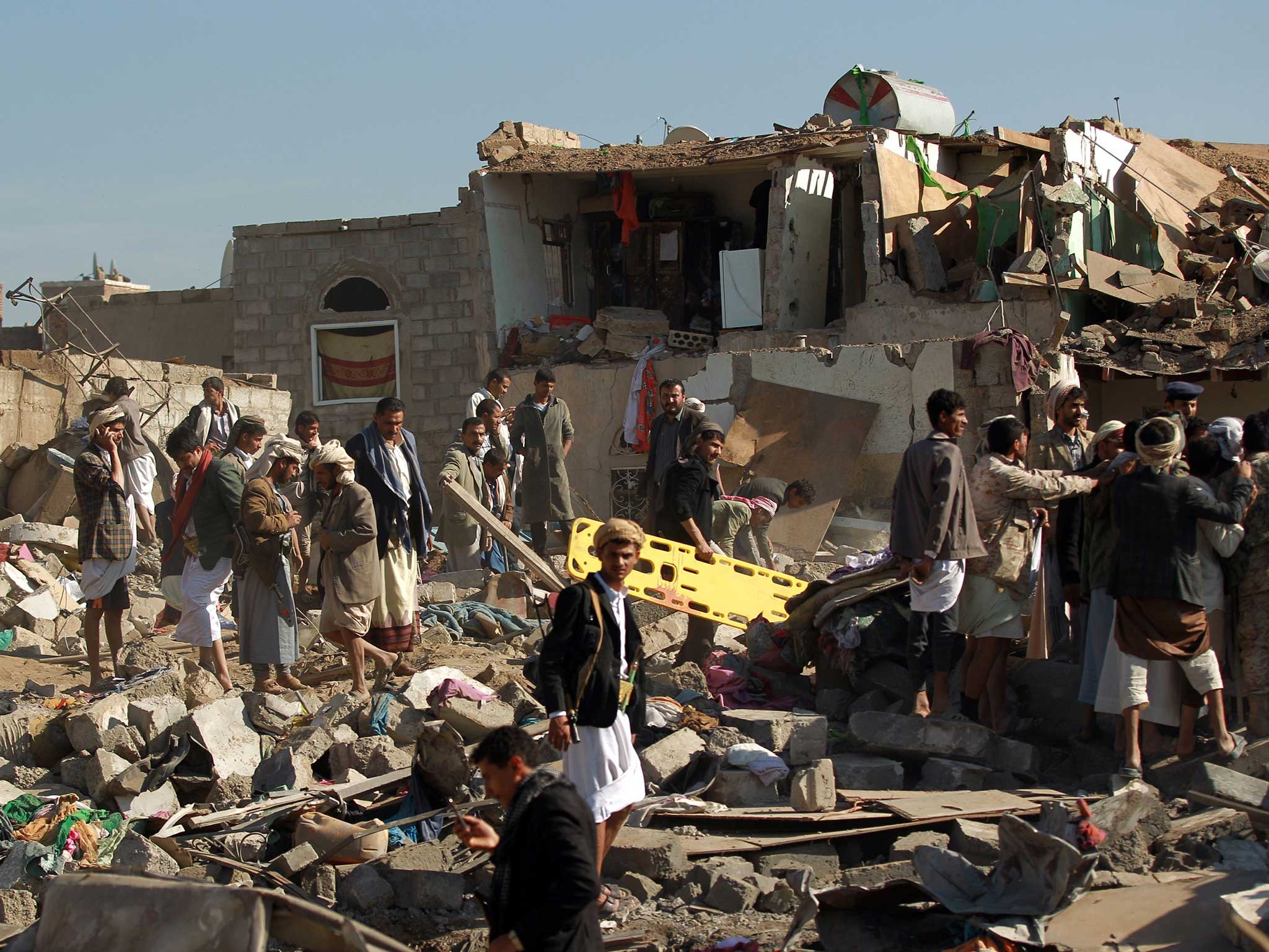 Residents survey the devastation of Saudi air strikes this morning