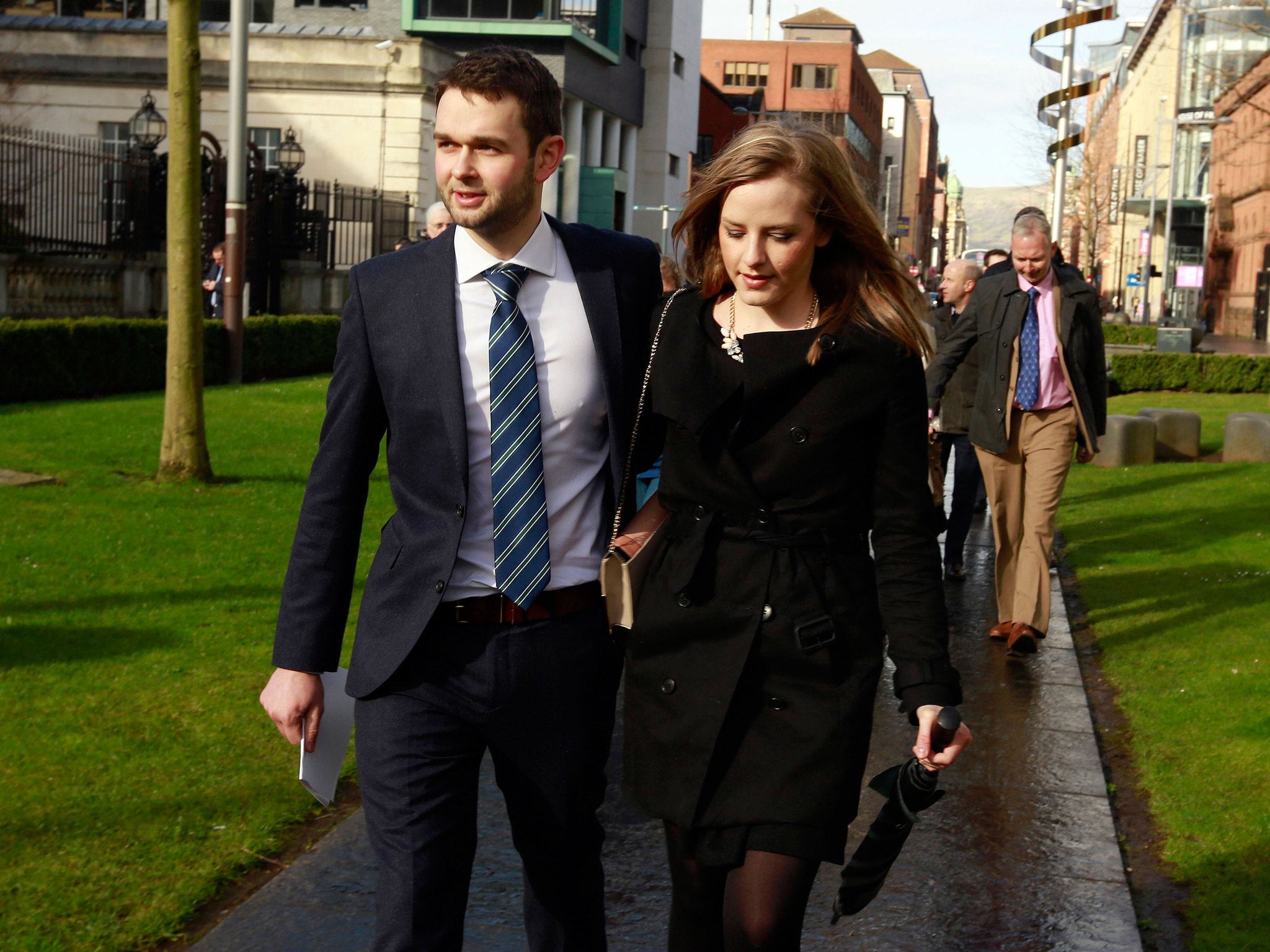 Daniel McArthur, general manager of Ashers bakery, arrives at court with his wife Amy