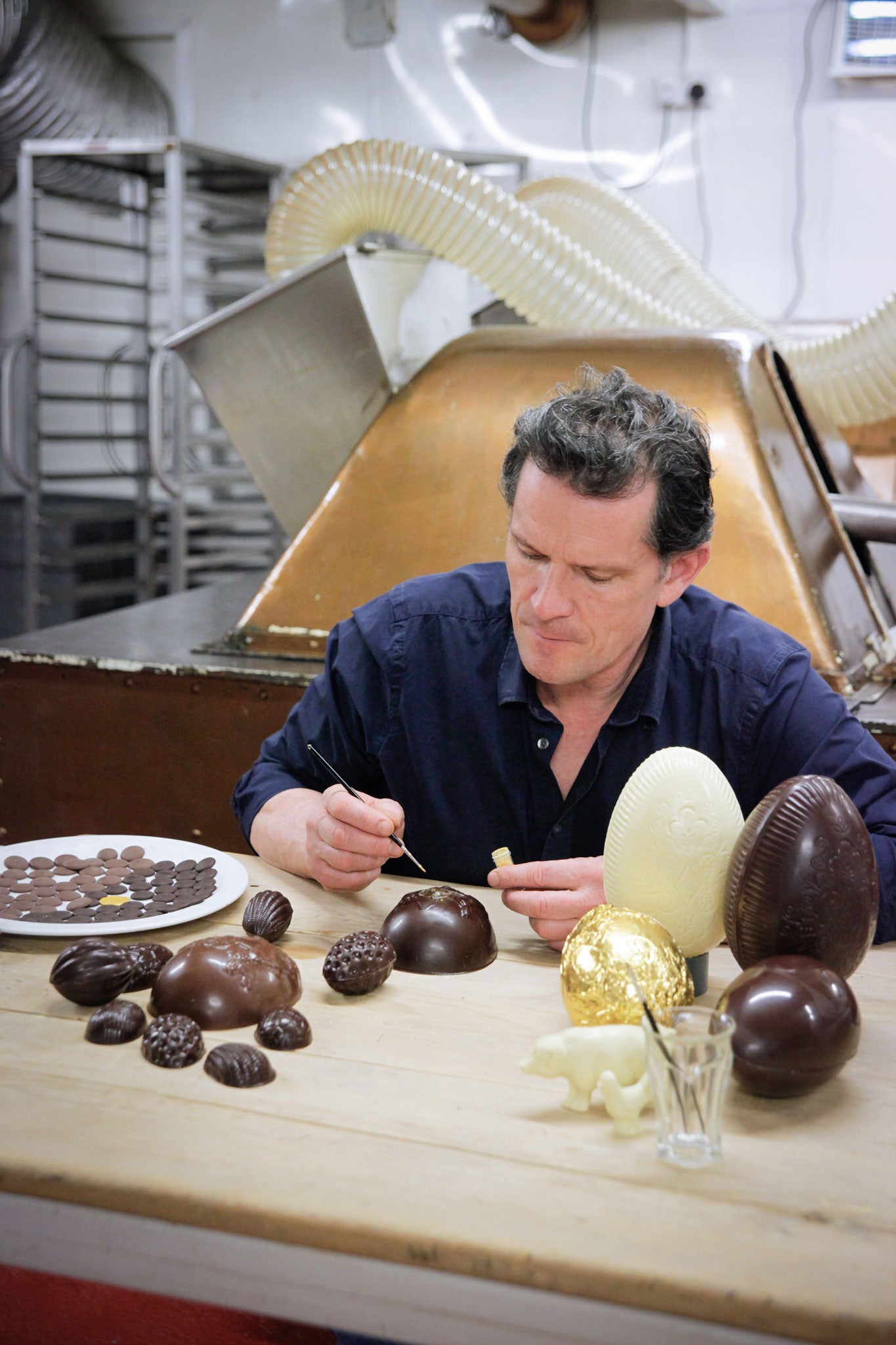 Willie paints his eggs using melted cocoa butter