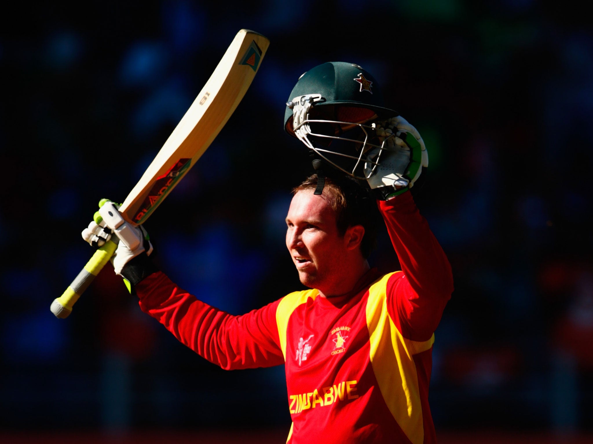 Taylor celebrates reaching 100 in his final innings for Zimbabwe (Getty)