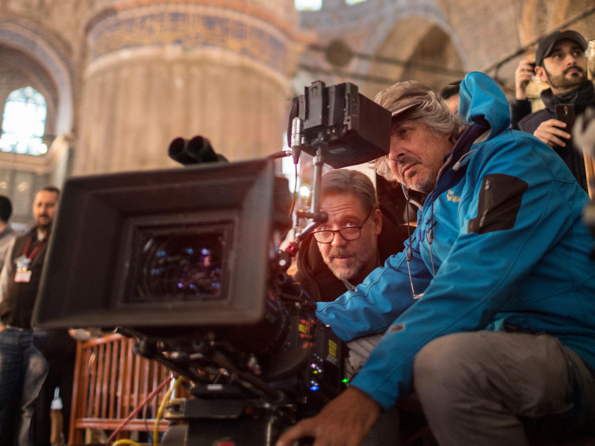 Russell Crowe sits in the director's chair