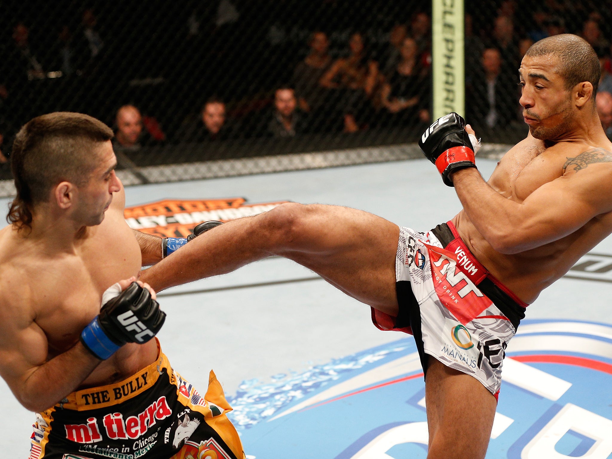 Jose Aldo (rigbht) in action