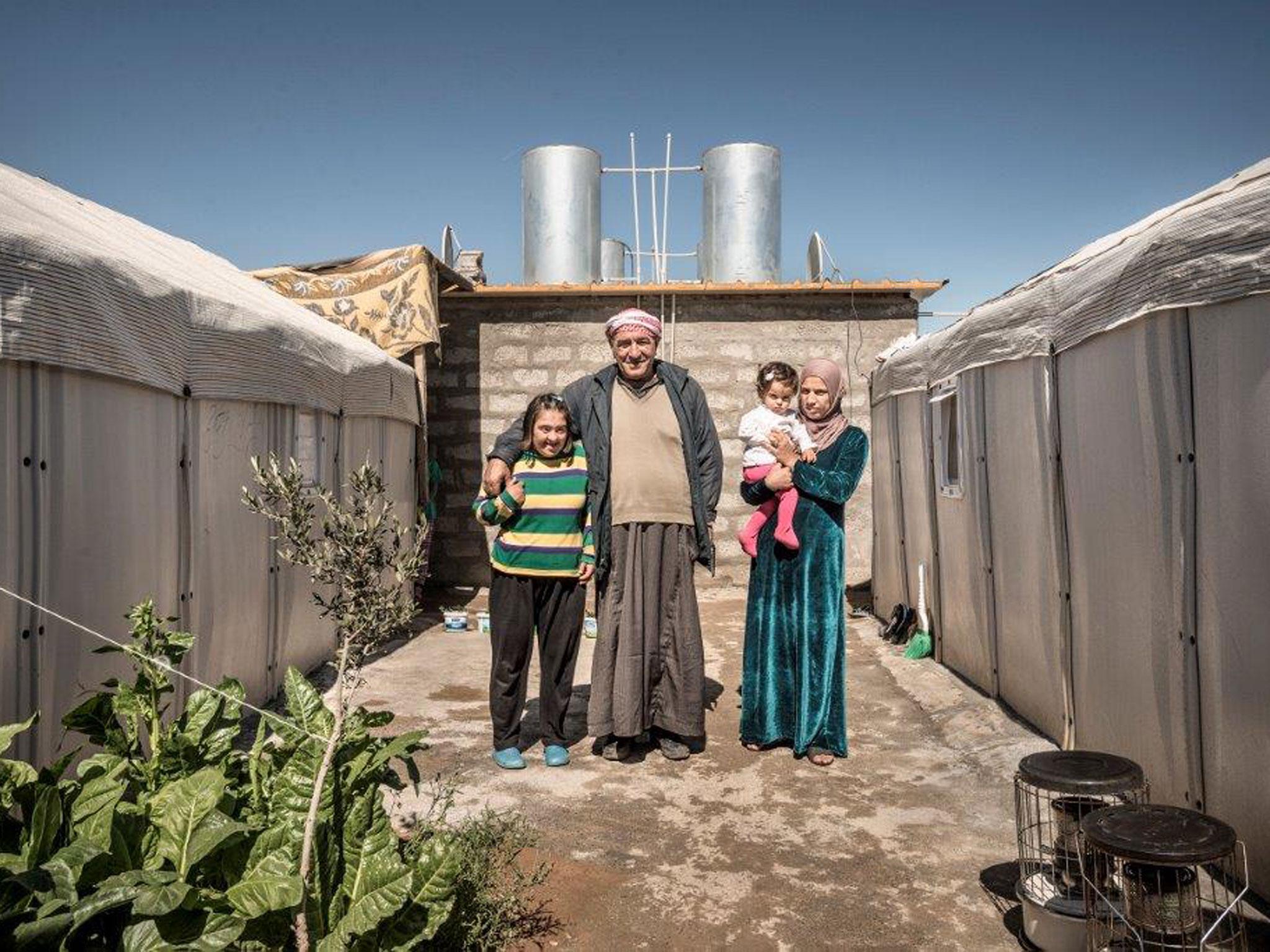 Hussein with daughters and grand daughter, Kawergosk Refugee Camp, Erbil, Iraq