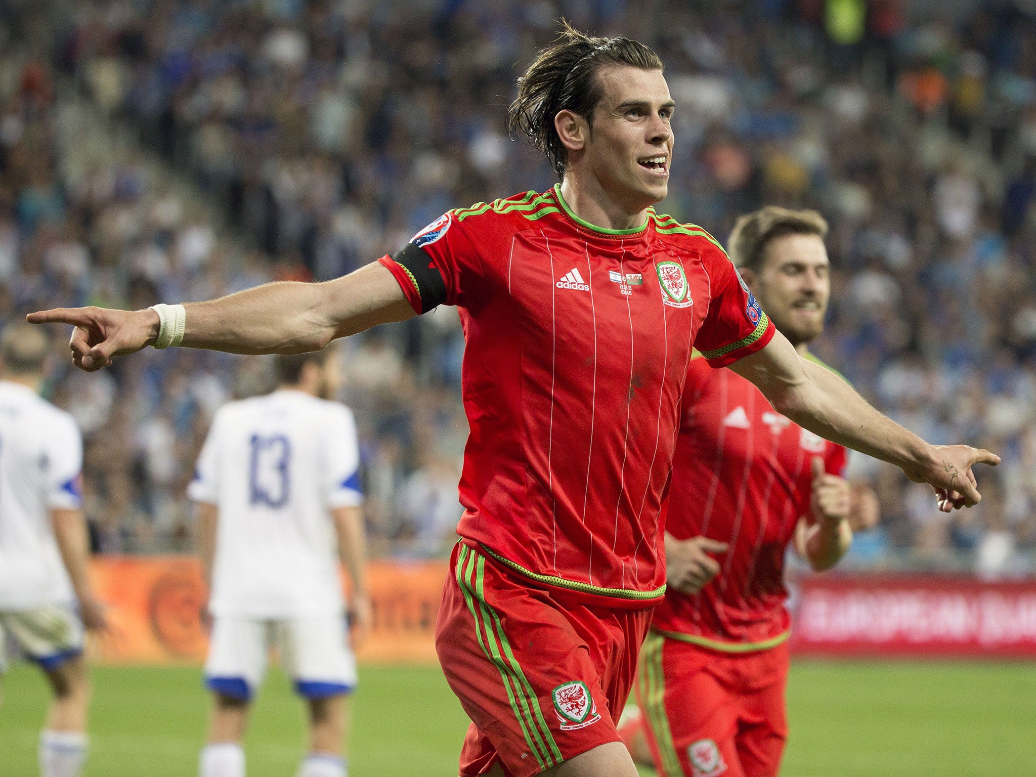 Gareth Bale celebrates scoring for Wales against Israel