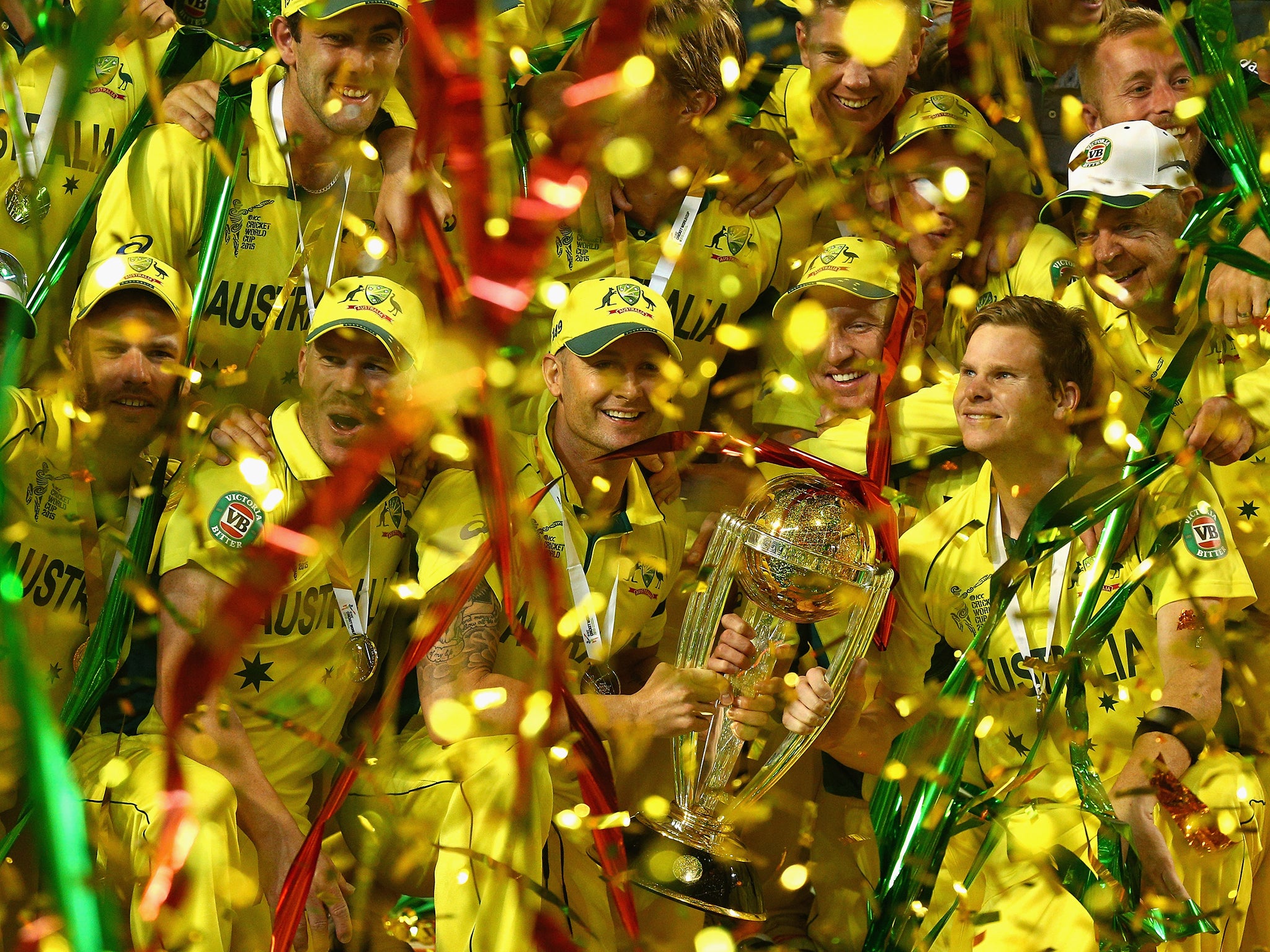 Australian captain Michael Clarke and Australian players celebrate winning the 2015 ICC Cricket World Cup final