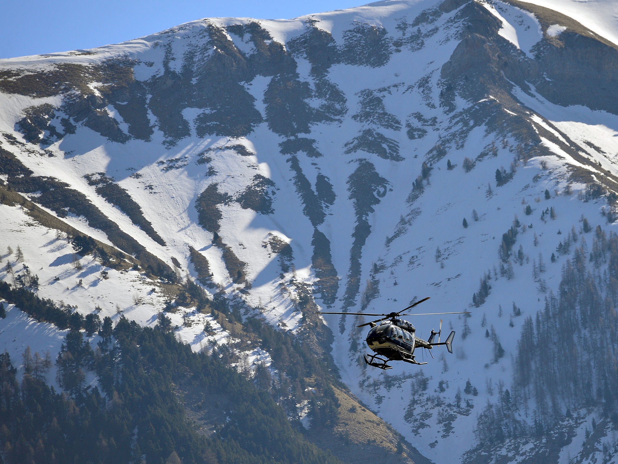 Rescue workers and gendarmerie continue their search operation near the site of the Germanwings plane crash on 29 March