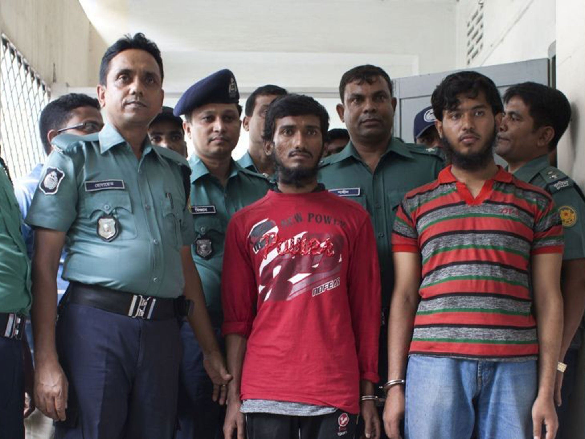 Bangladesh police officials parade suspects after blogger Washiqur Rahman was hacked to death in Dhaka