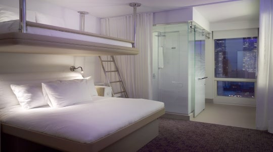 Yotel hotel rooms are smaller than traditional hotel rooms but offer free wifi, lots of plug sockets, flat screen TVs and automated check in.