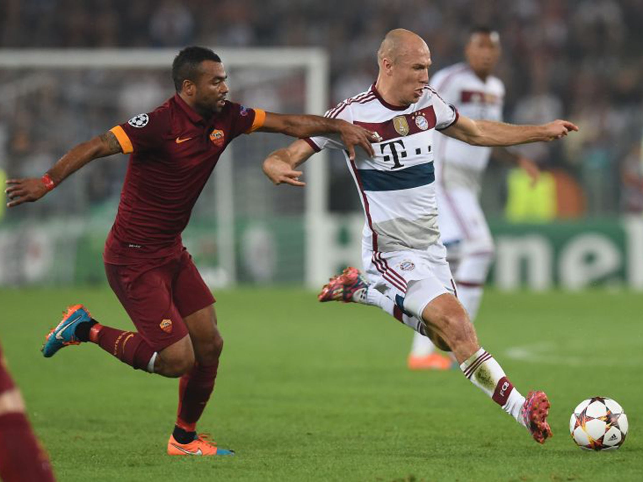 Ashley Cole has struggled on the pitch with Roma this season, having a hard time against Arjen Robben, right, in a heavy defeat to Bayern Munich, but off it has embraced life in Italy