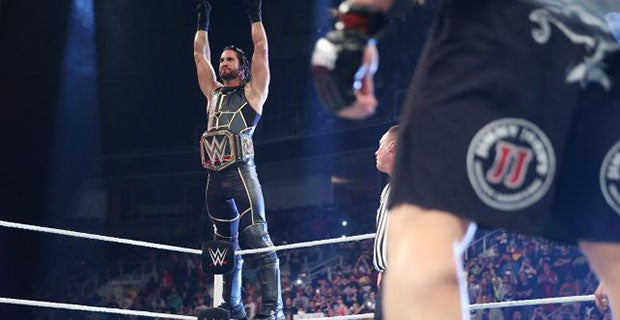 Rollins shows off his new WWE World Heavyweight title