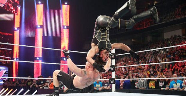 Lesnar suplex's Rollins, although the champion lands on his feet