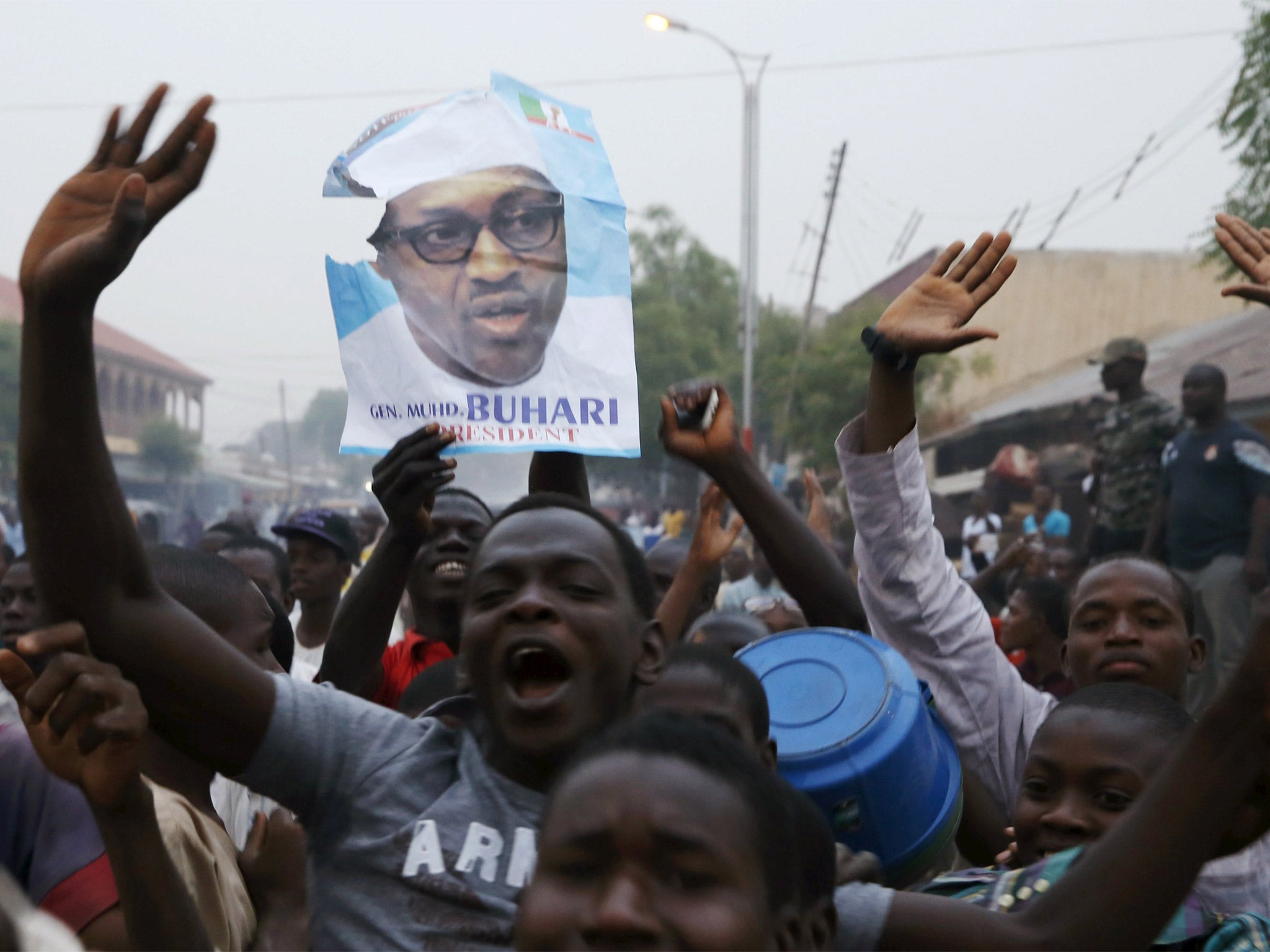 Supporters of Muhammadu Buhari and his All Progressive Congress party (APC) celebrate in Kano after Buhari swept to victory in Nigeria’s presidential elections