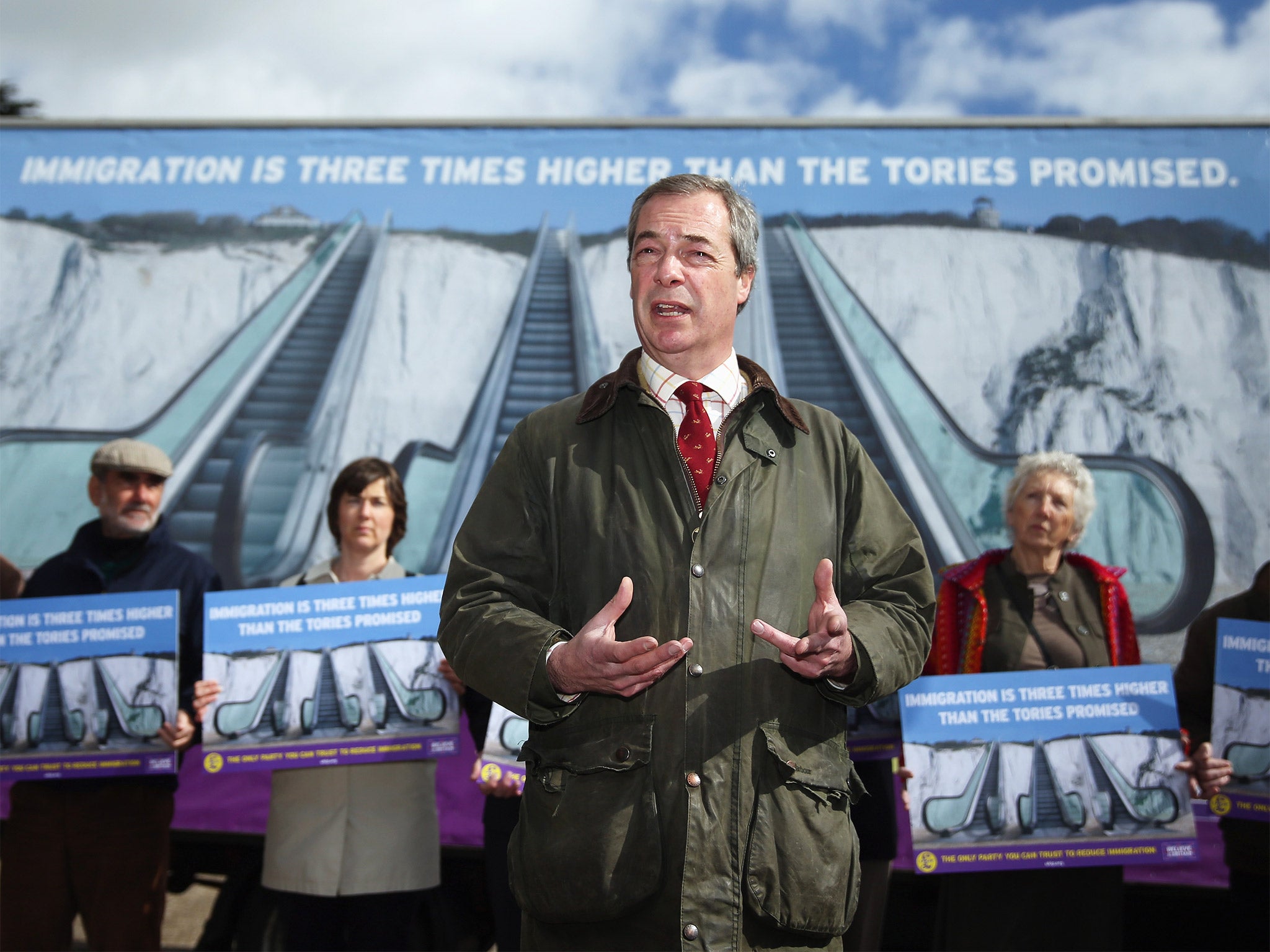 Nigel Farage unveiled Ukip’s latest campaign poster in Dover yesterday (Getty)