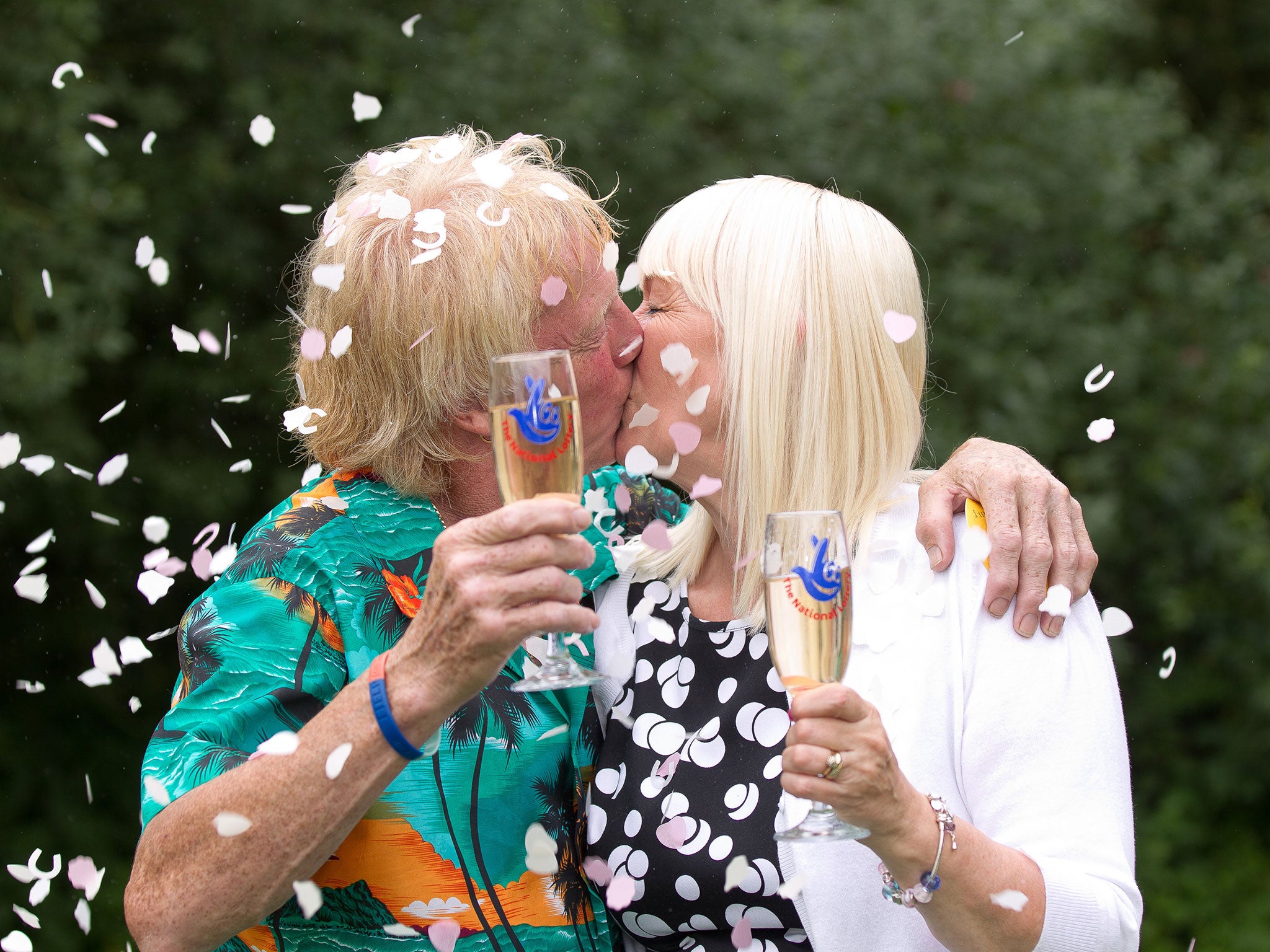 David and Kathleen Long with their cheques after winning £1 million in the EuroMillions