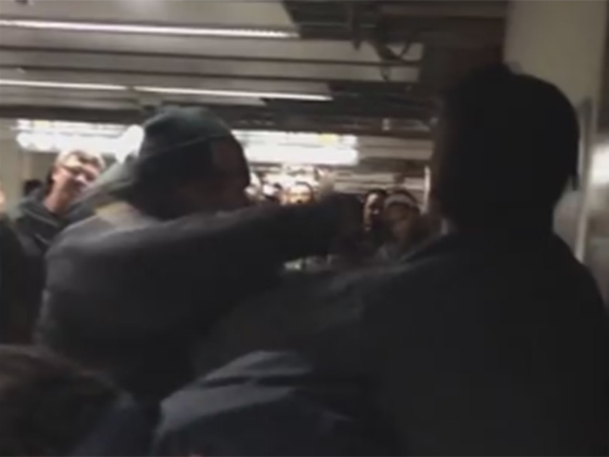 A TTC officer appears to punch a man in the video