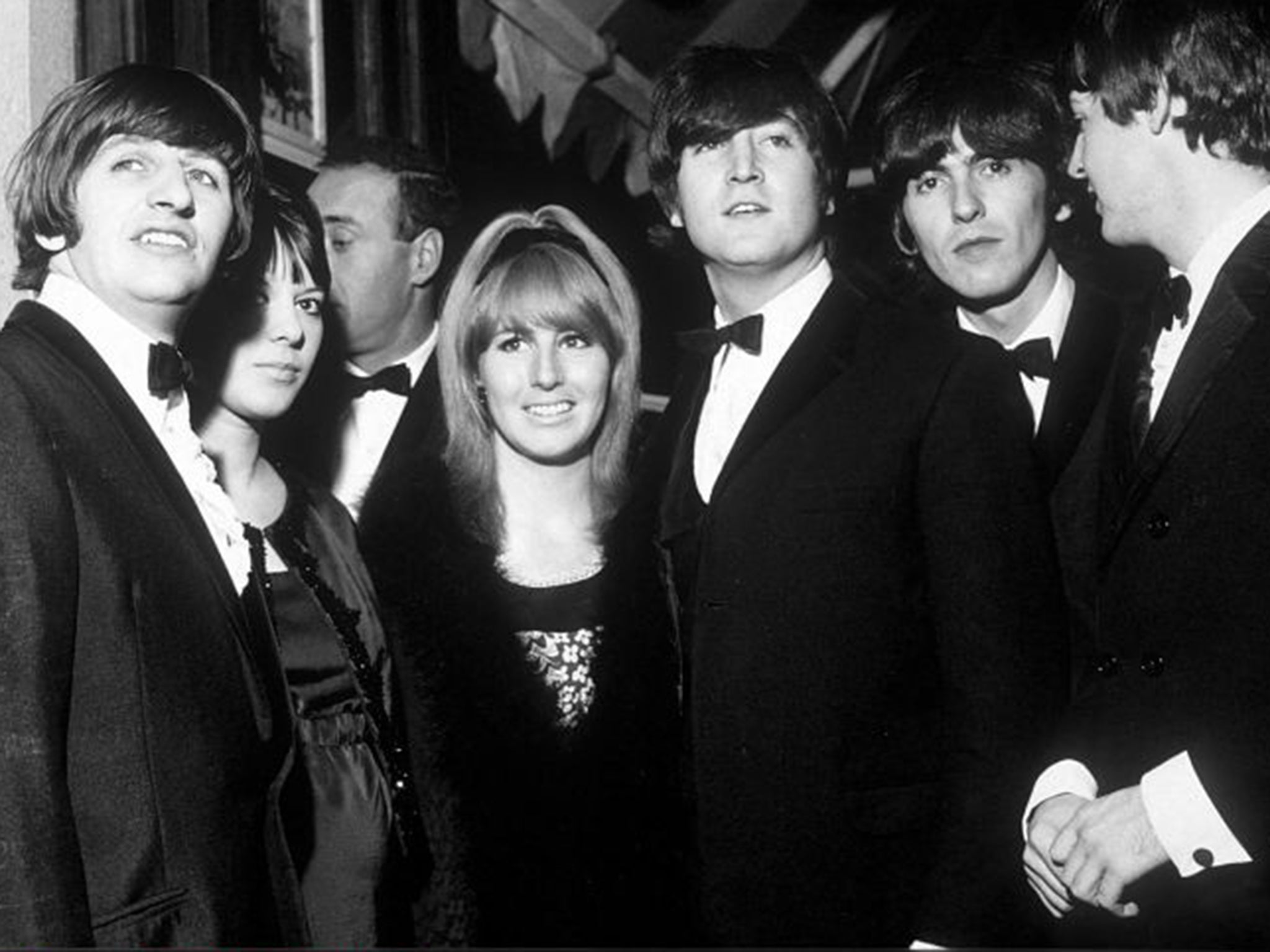 Eye of the storm: Lennon, centre, with the Beatles (and Ringo's wife Maureen) at the premiere of 'A Hard Day’s Night' in 1964