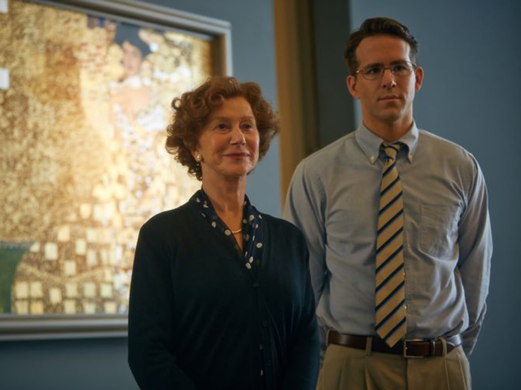 Buttoned up: Ryan Reynolds with Helen Mirren in ‘Woman in Gold’