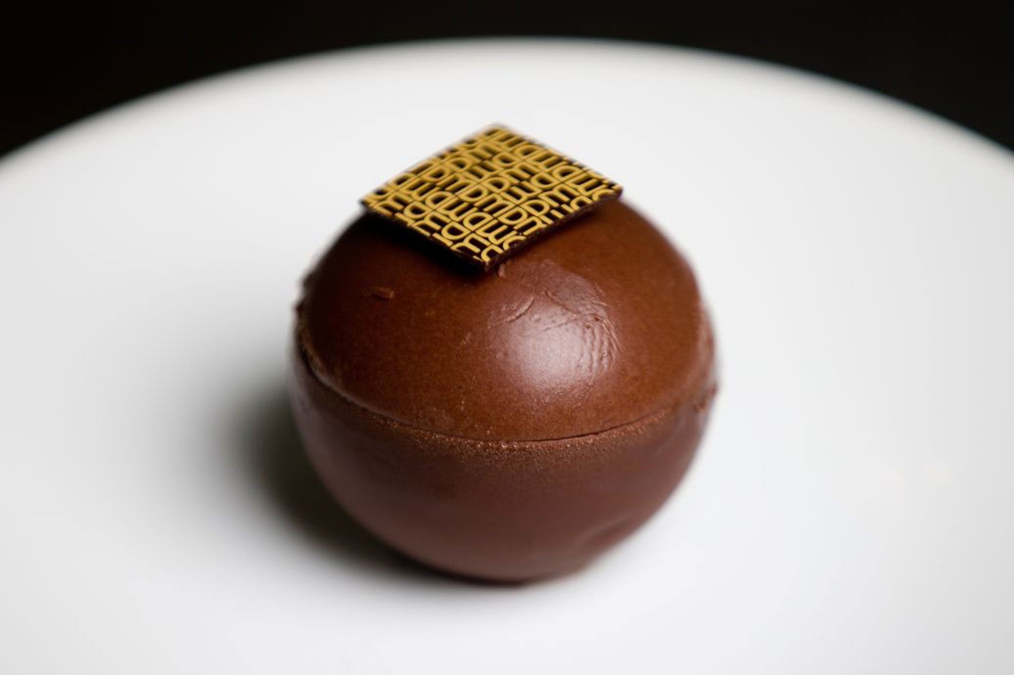 The Jaffa Sphere is a round ball of chocolate mousse enclosing marmalade