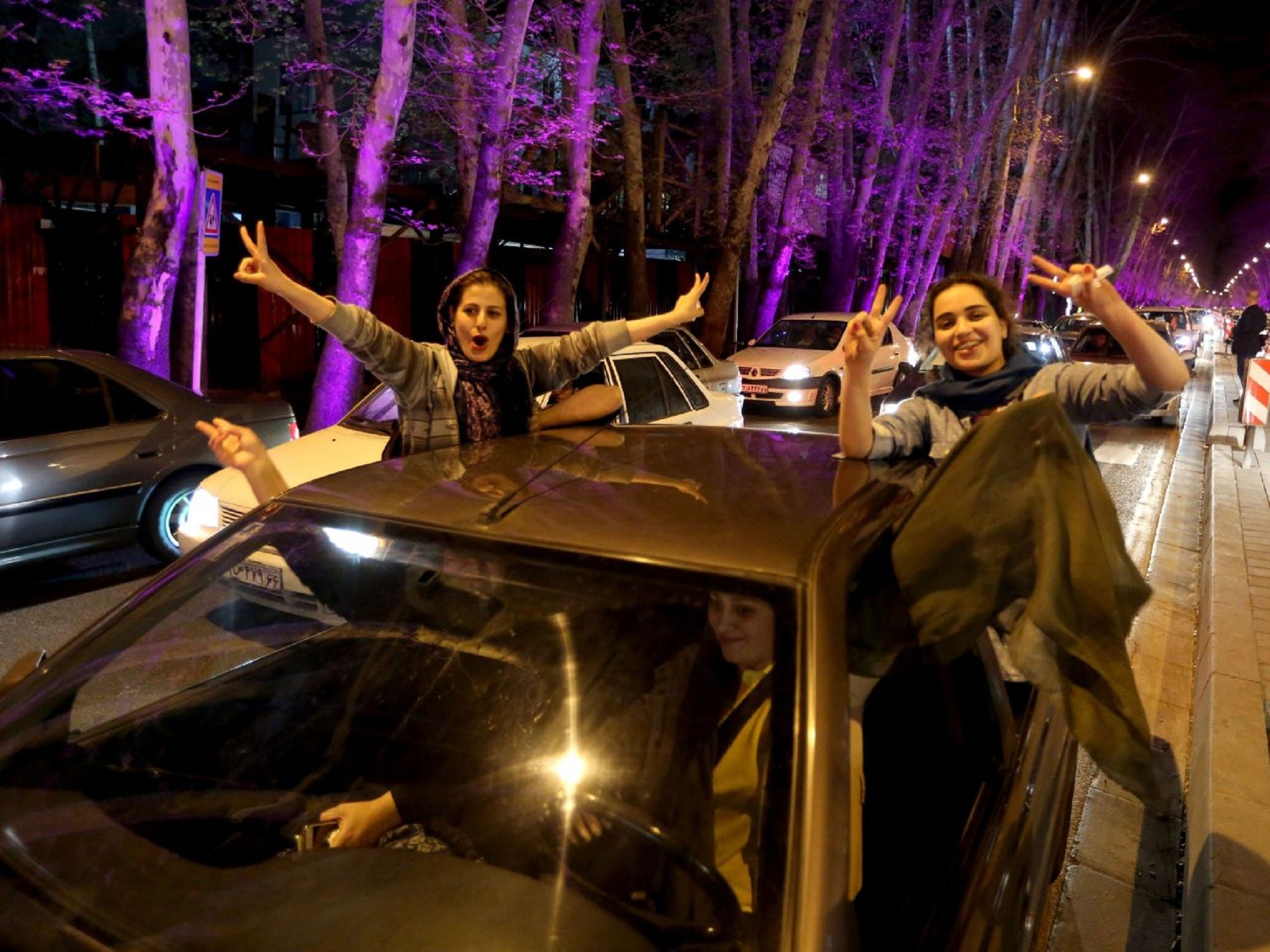 Women in Tehran celebrate the announcement of a framework agreement