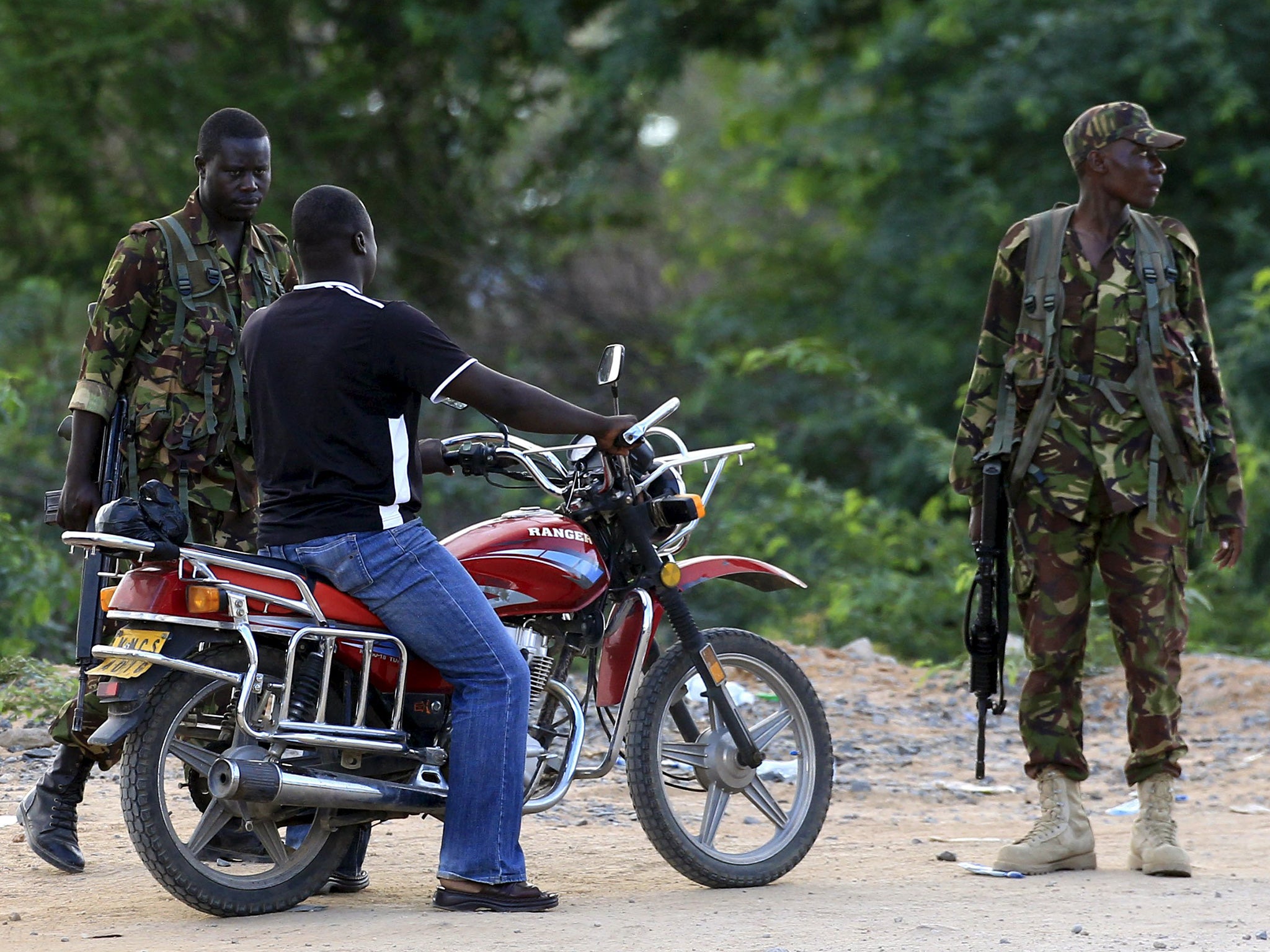 Soldiers guard survivors at a hospital