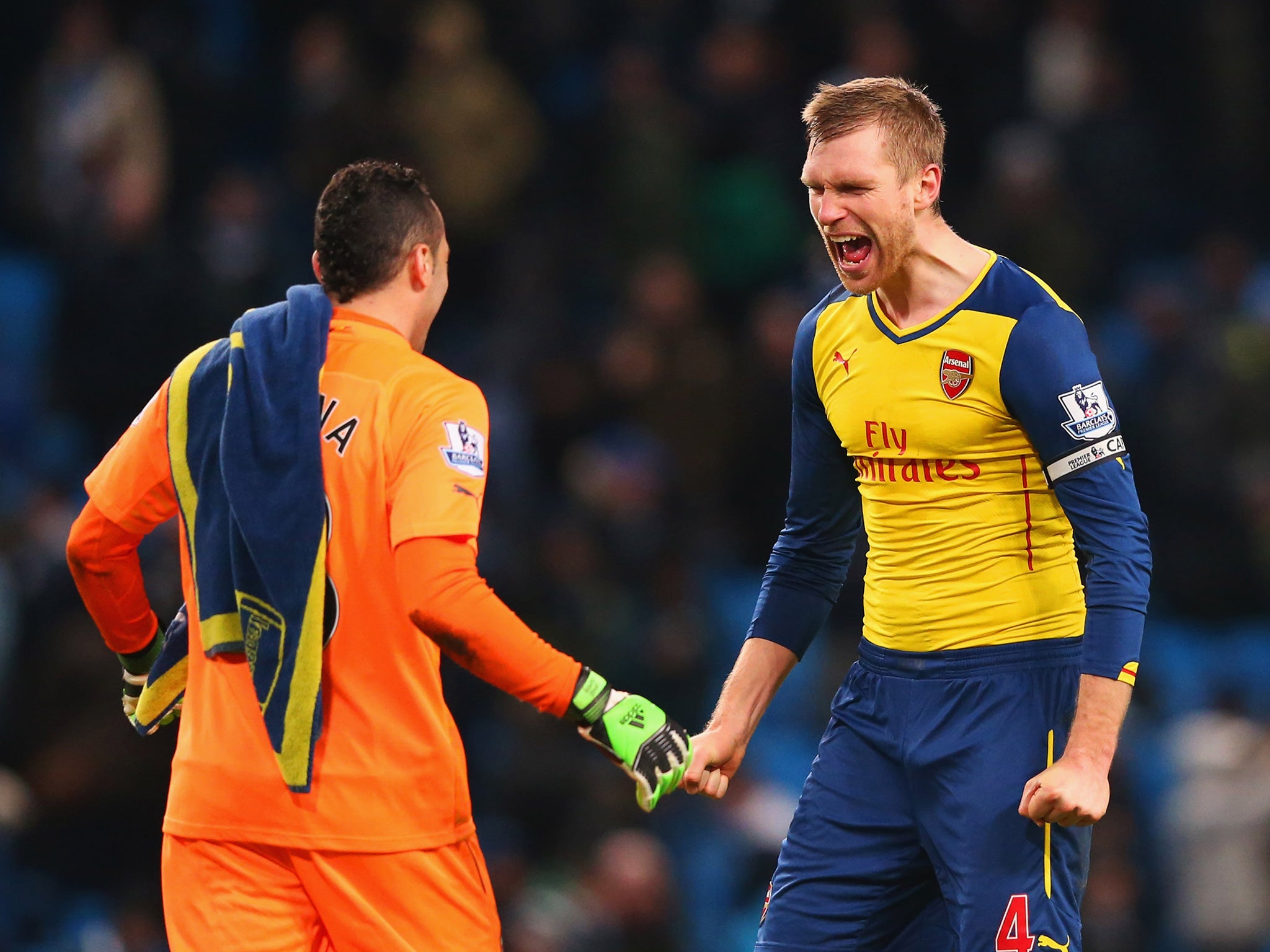 Enjoying victory over City with David Ospina (Getty)