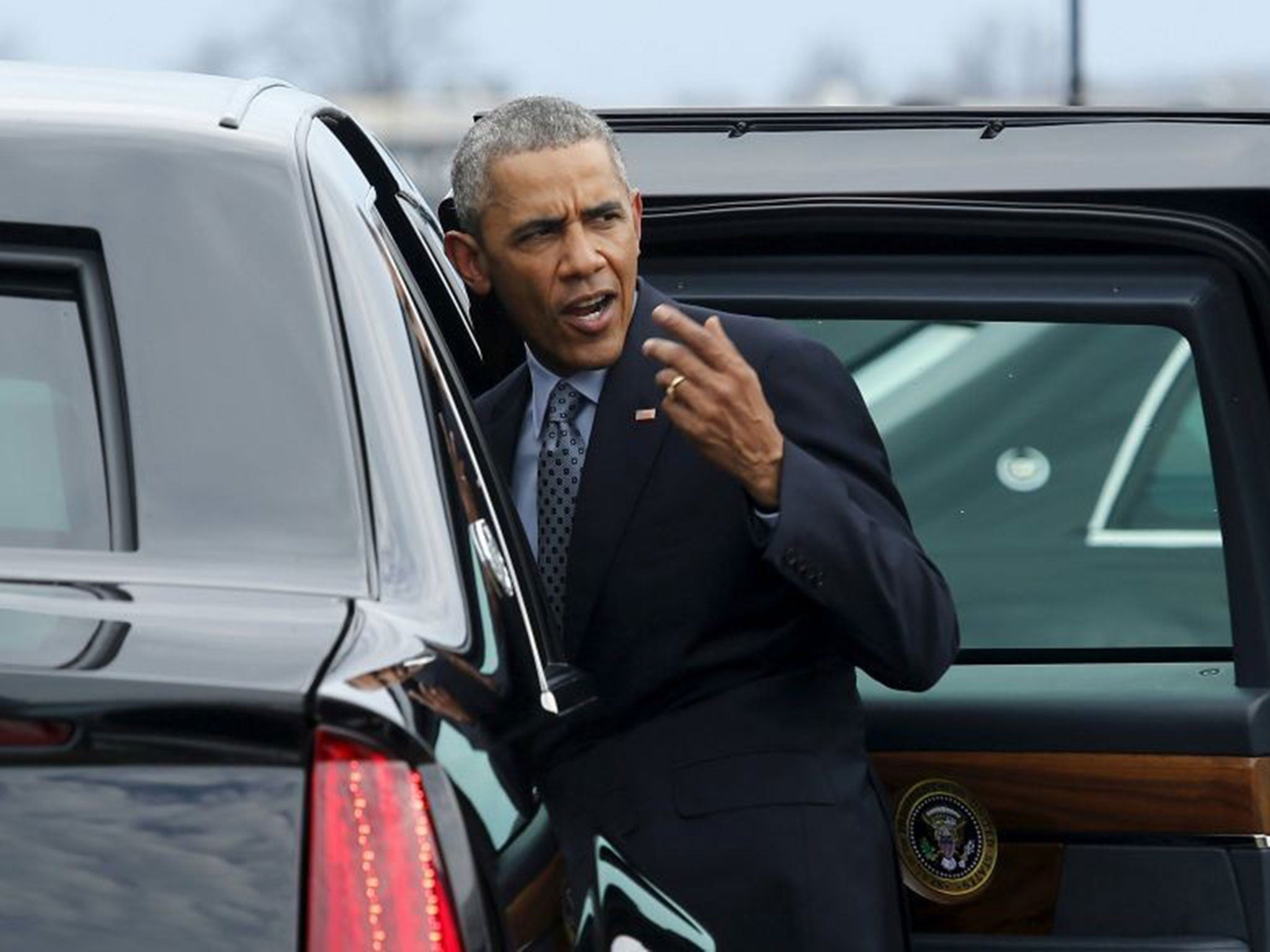 President Barack Obama gets into his limousine after arriving at Louisville International Airport in Kentucky on 2 April