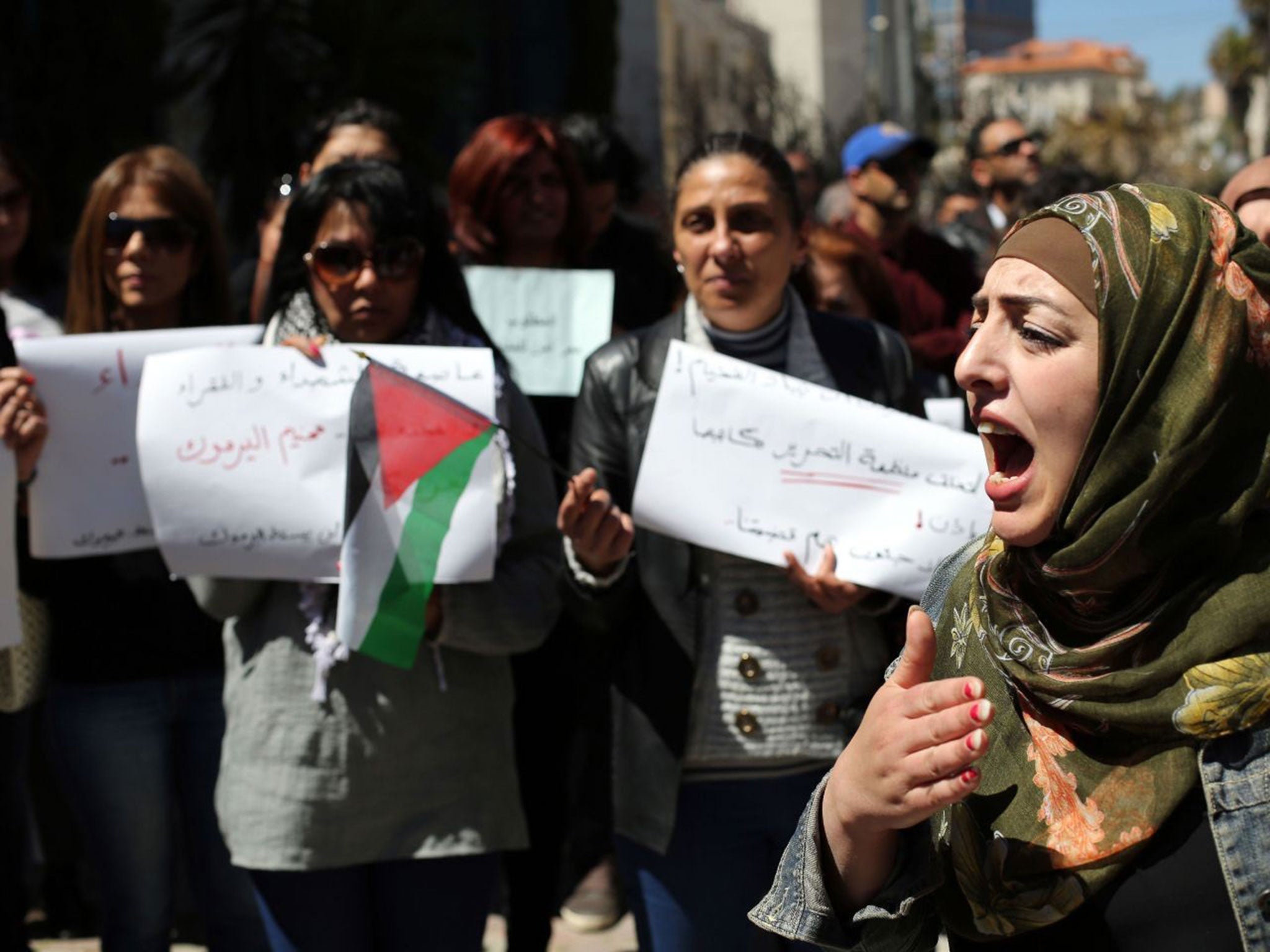 Palestinians at a protest in solidarity with refugees in Syria's Yarmouk camp on 5 April in Ramallah