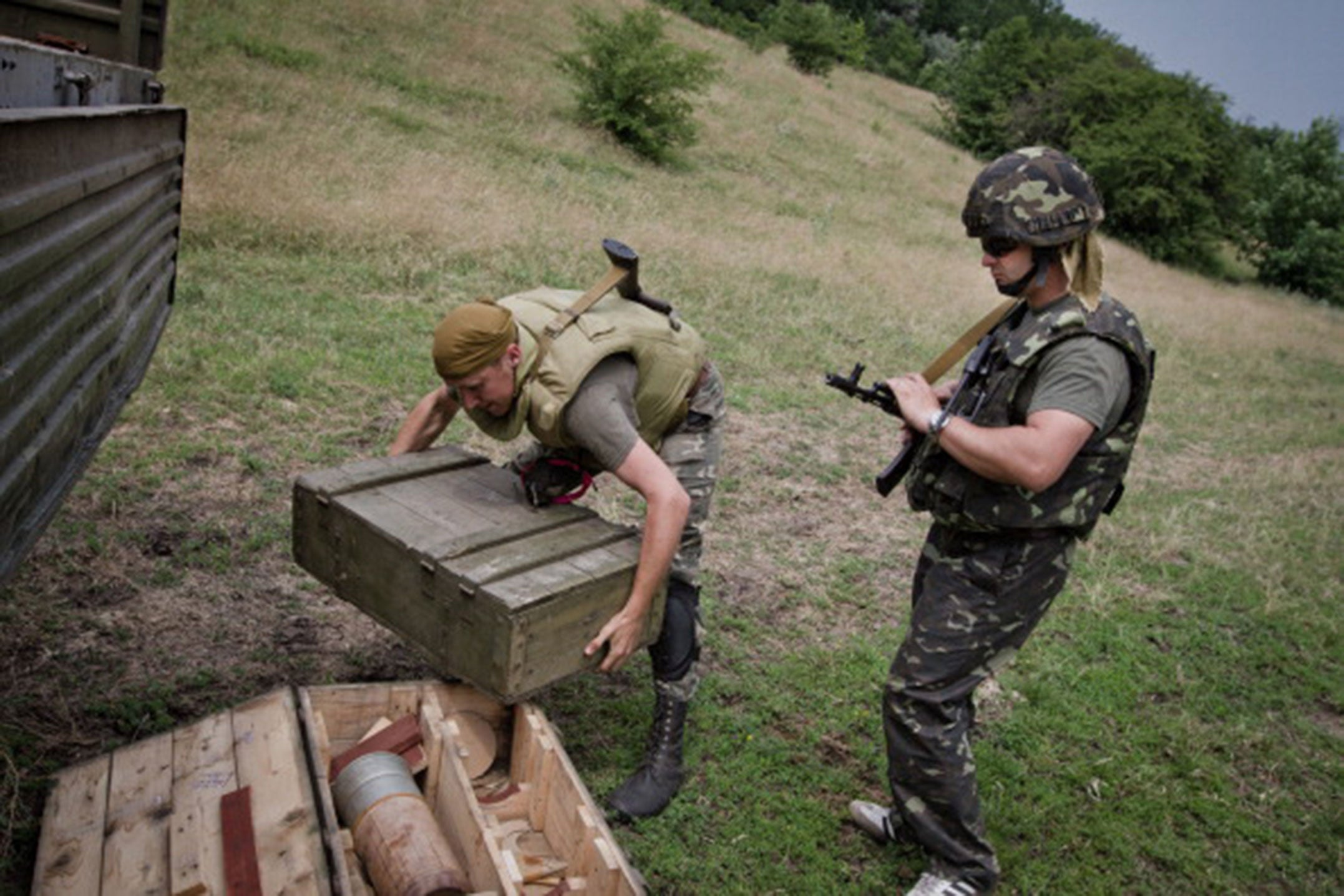 Ukrainian army soldiers transport home-made bombs