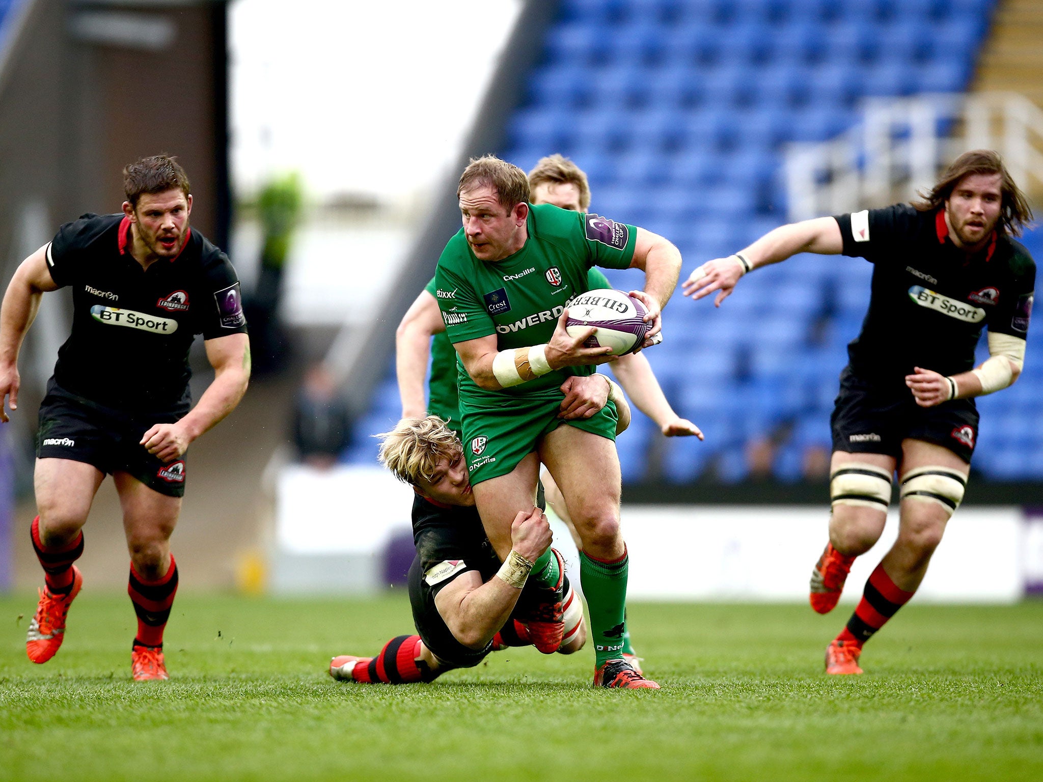 David Paice of London Irish is tackled by David Denton of Edinburgh during the European Challenge Cup quarter-final