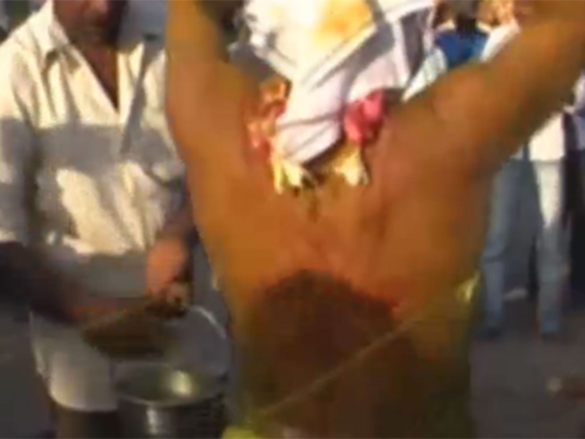 The men pierce their bodies with thread as they chant songs and dance to traditional music