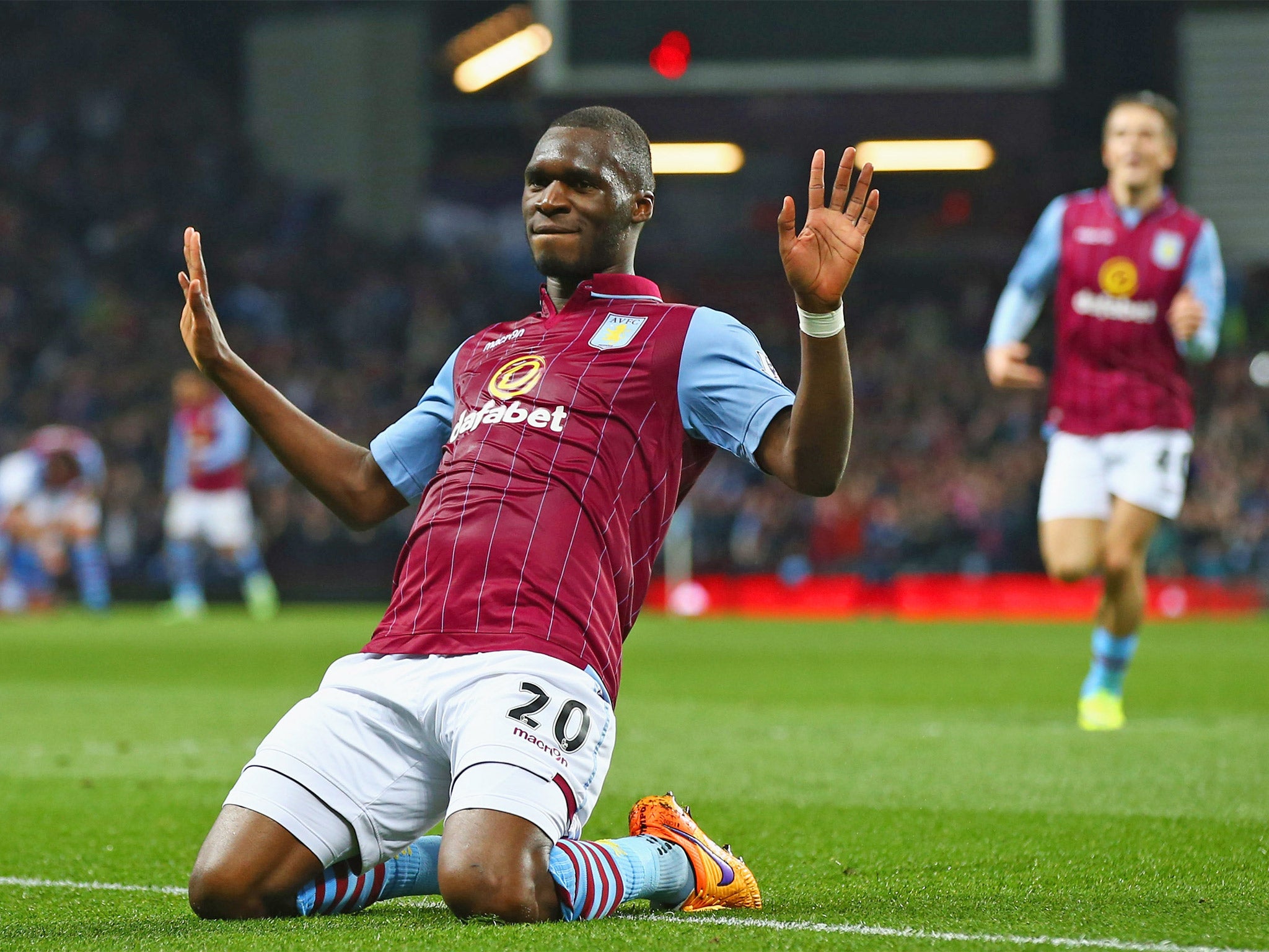 Aston Villa striker Christian Benteke salutes the home crowd after his second goal