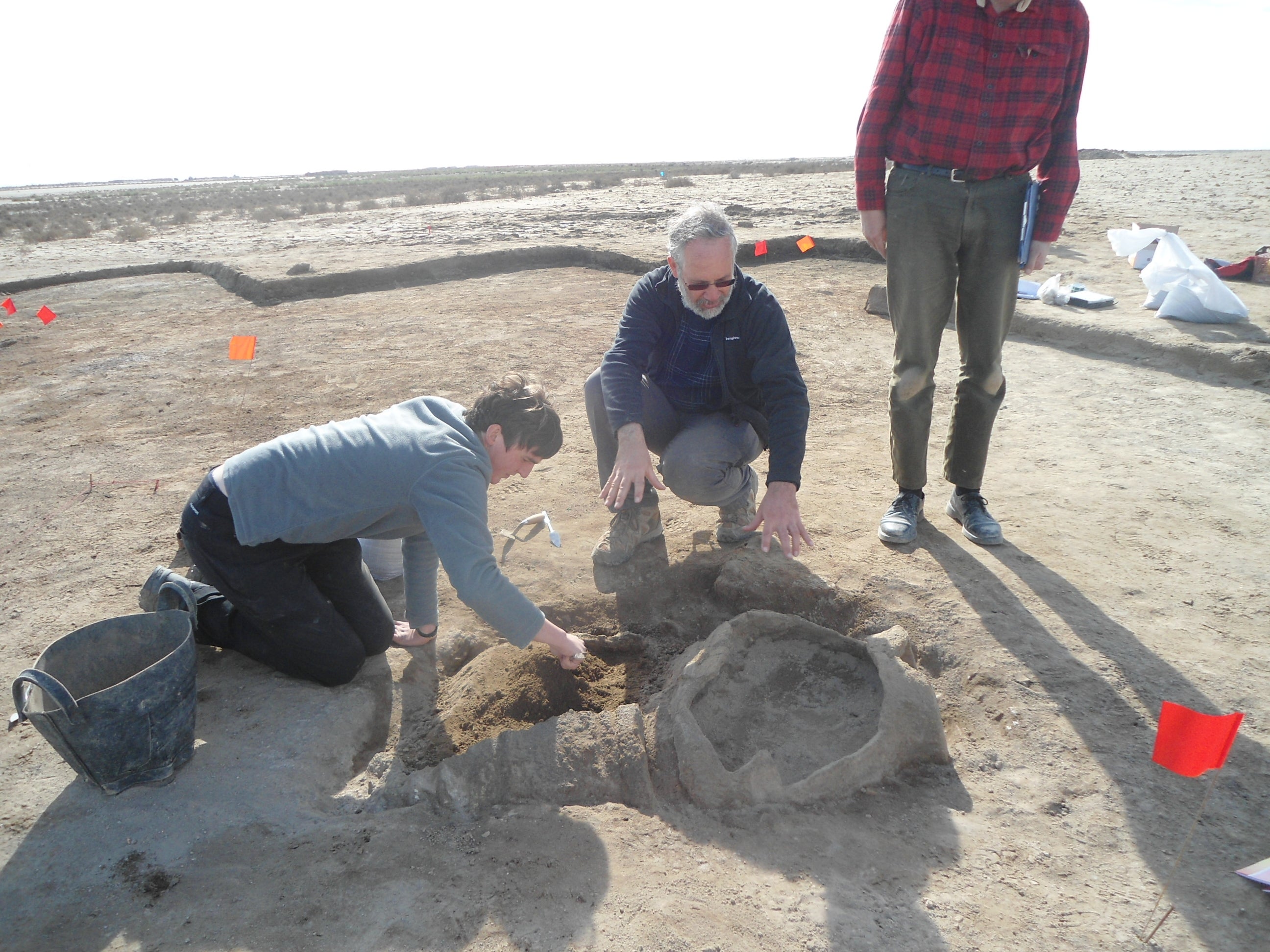 An elderly person buried in two pots. Daniel Calderbank, a Manchester PhD student, and Professor Stuart Campbell, working on uncovering it (Pic: University of Manchester)