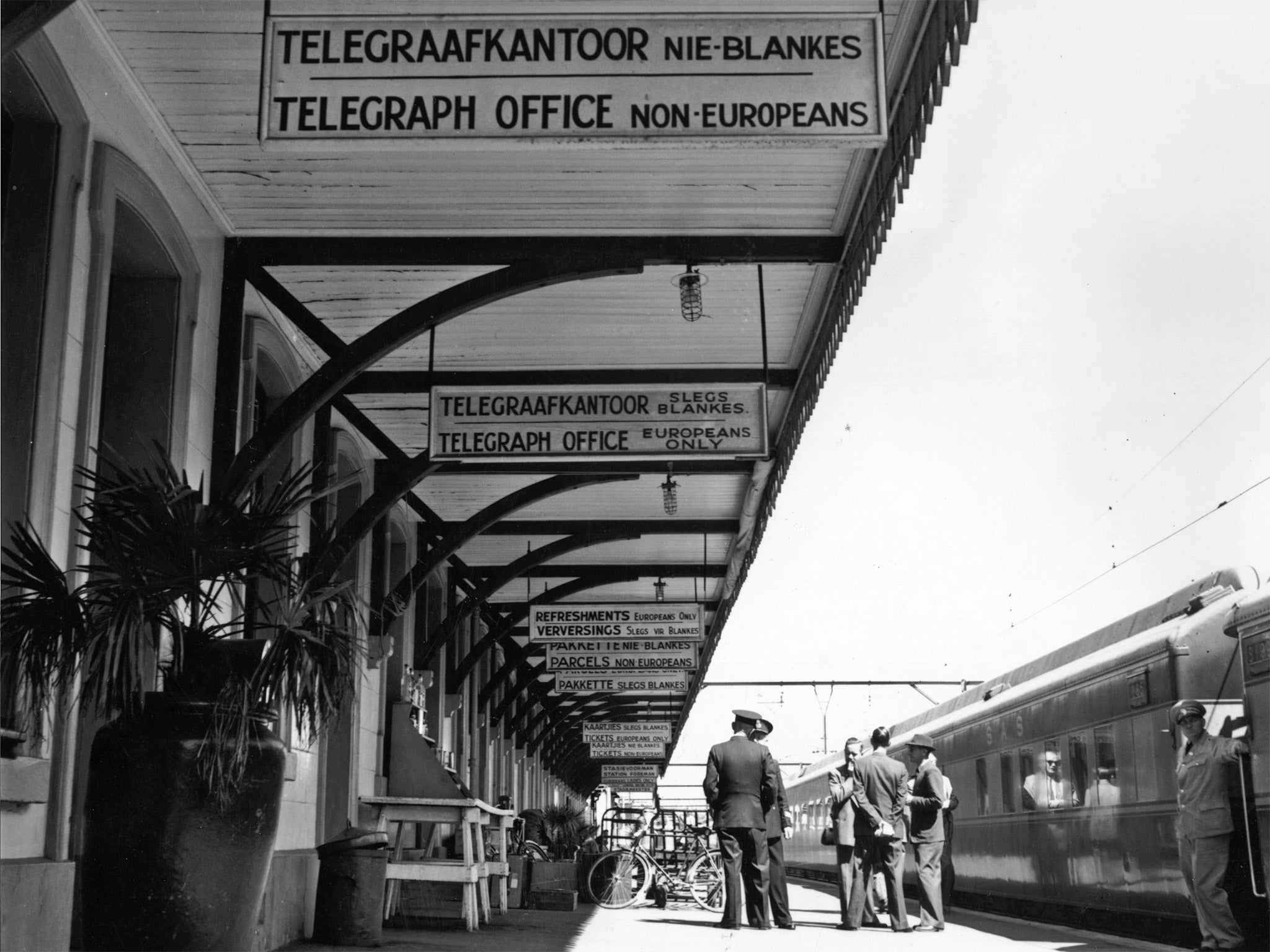 Racial segregation signs in English and Afrikaans, at Wellington railway station (Getty)