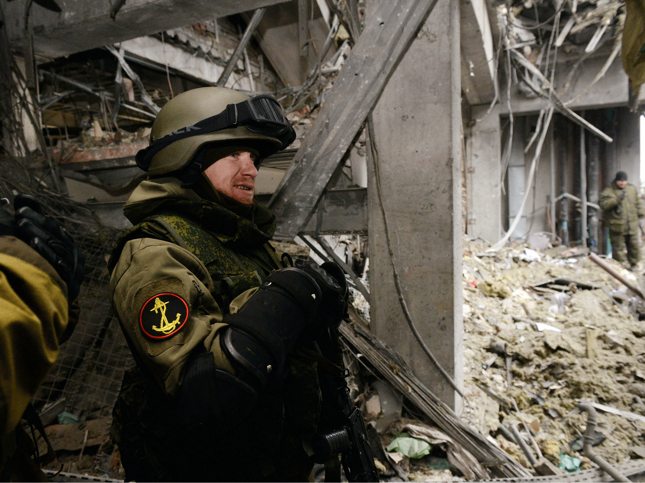 Pro-Russian separatist commander 'Motorola' stands inside a destroyed airport building in the eastern Ukrainian city of Donetsk, on February 26, 2015