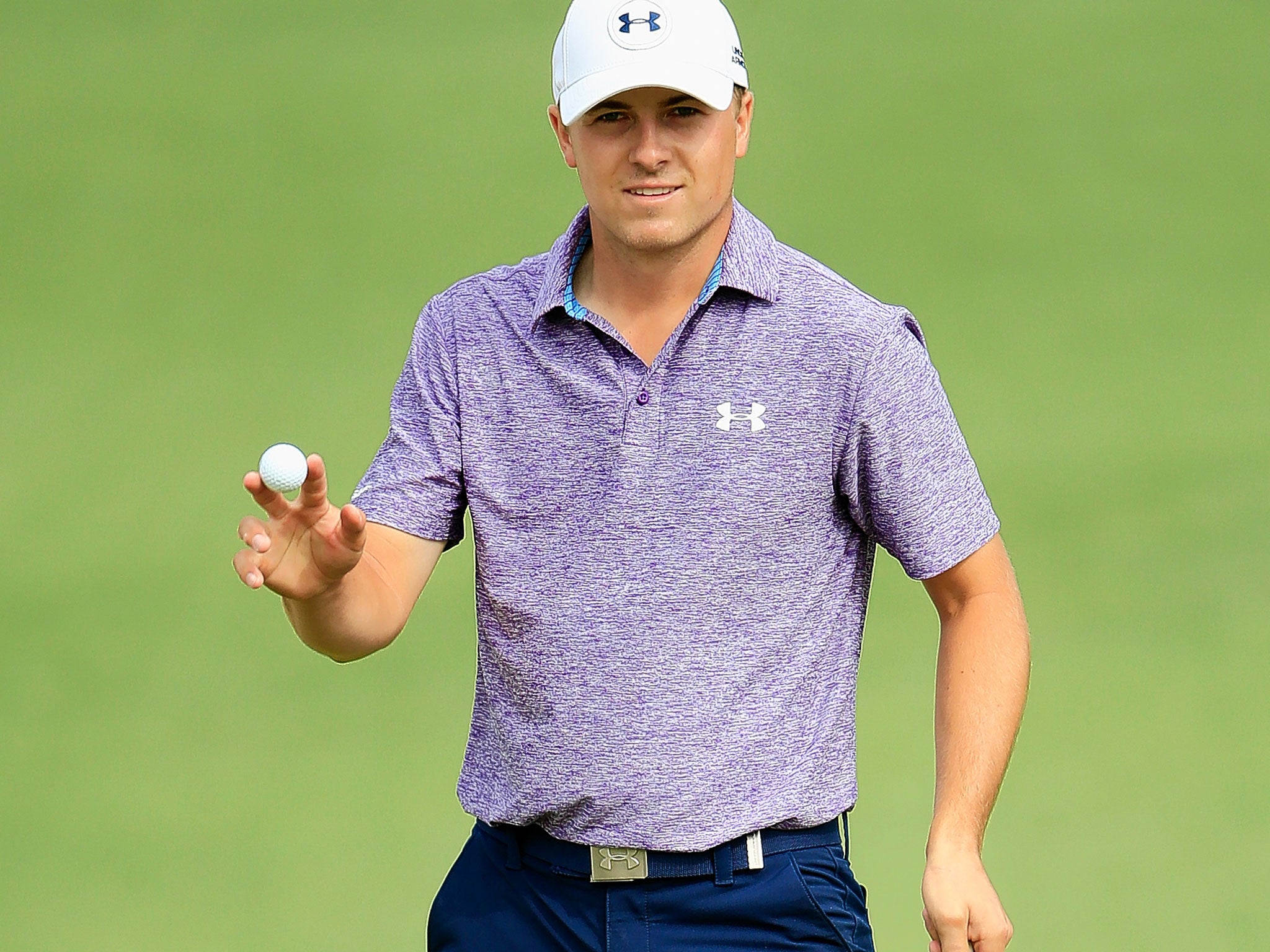 Spieth salutes the crowd after picking up a birdie at the second hole