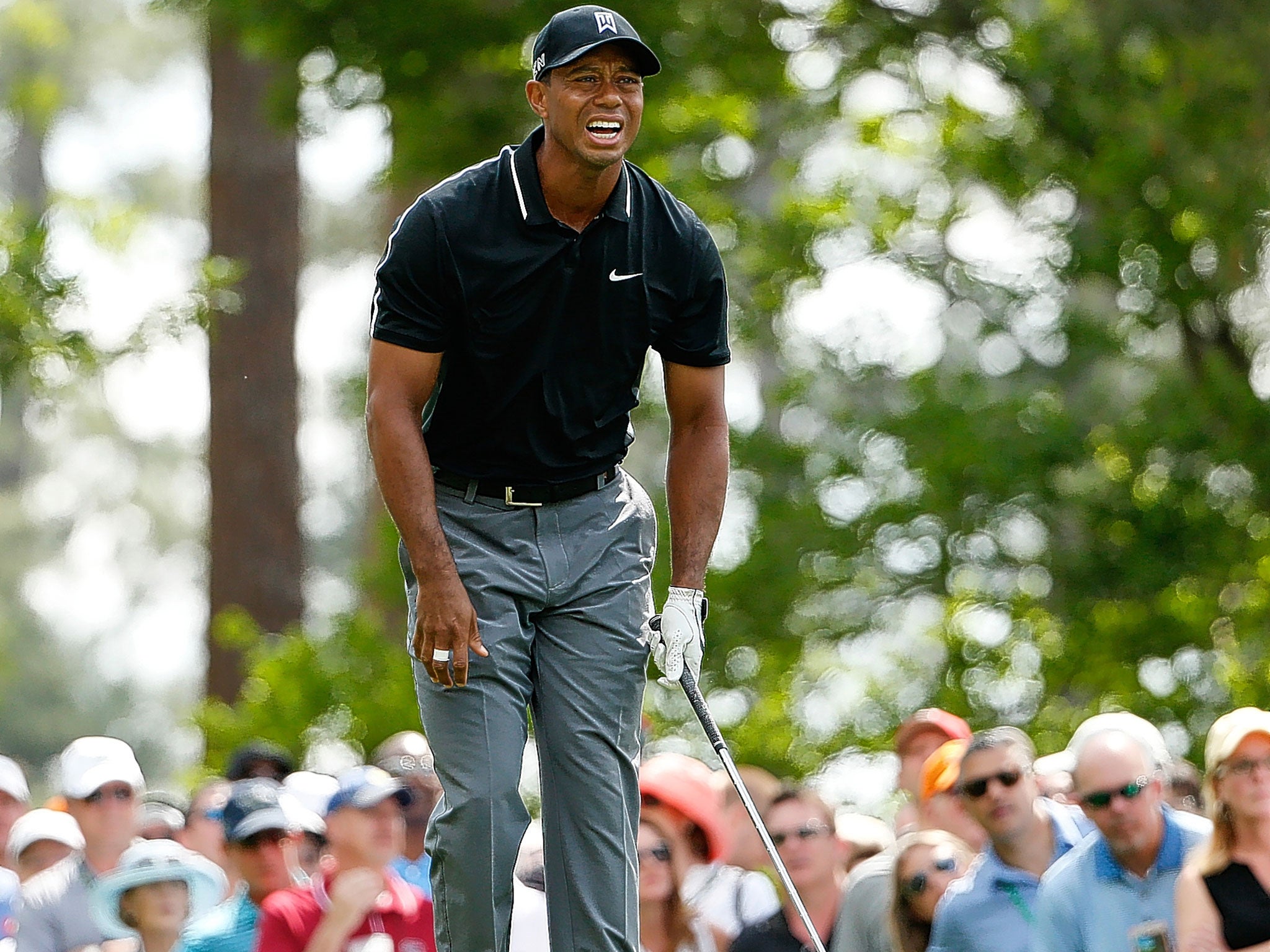 Tiger Woods showed his survival instincts in a bumpy start to the Masters