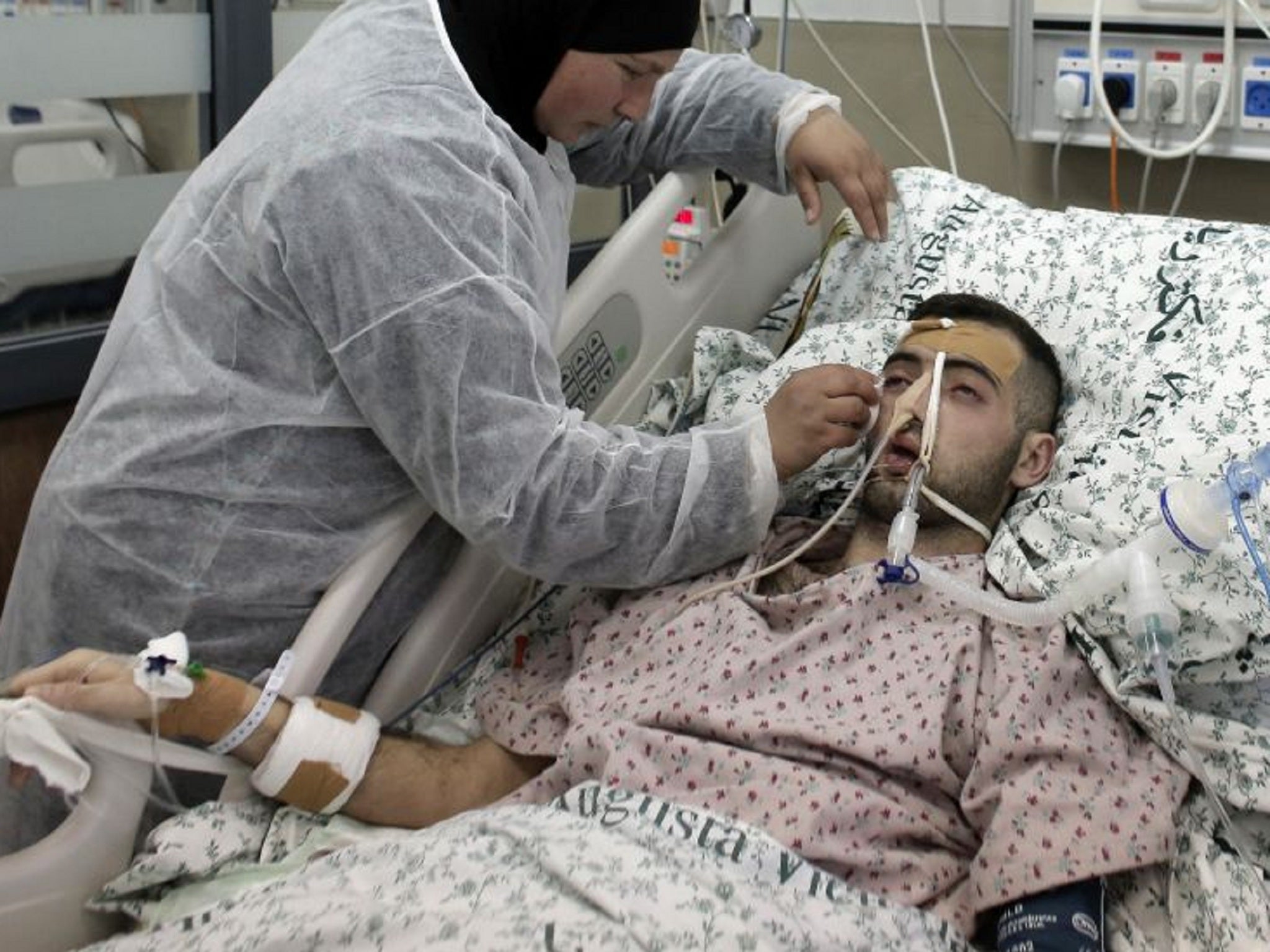 Jafaar with his mother while in hospital following release from prison