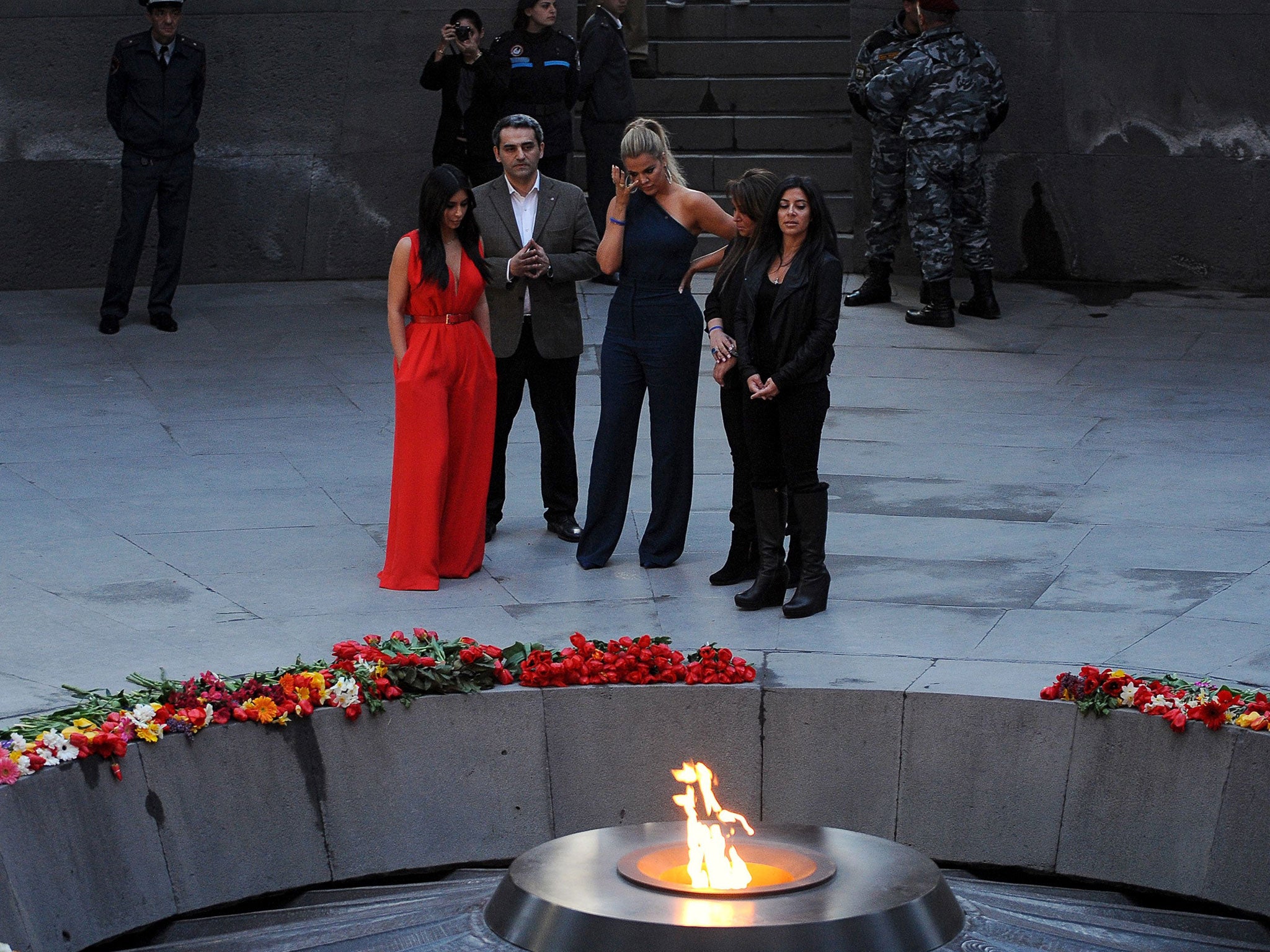 Kim Kardashian (L) and her sister Khloe (3rdL) visit the genocide memorial