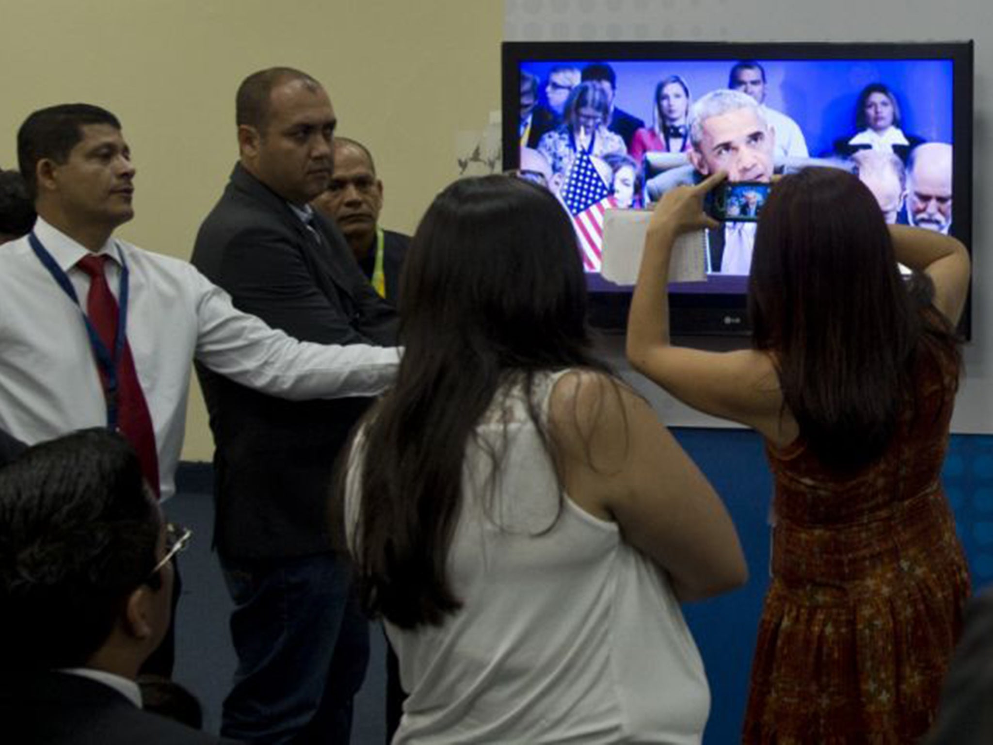 Journalists watching President Obama’s speech from the press room at the Summit in Panama City