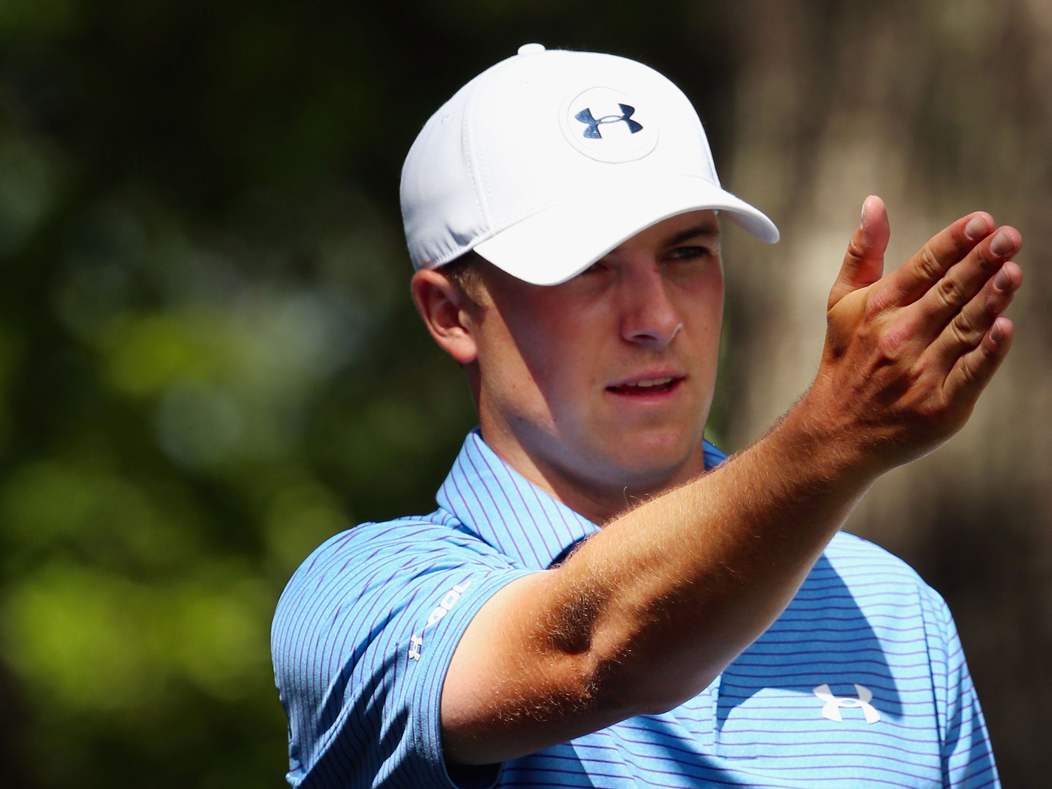 Jordan Spieth reacts after missing a par-putt at the fourth
