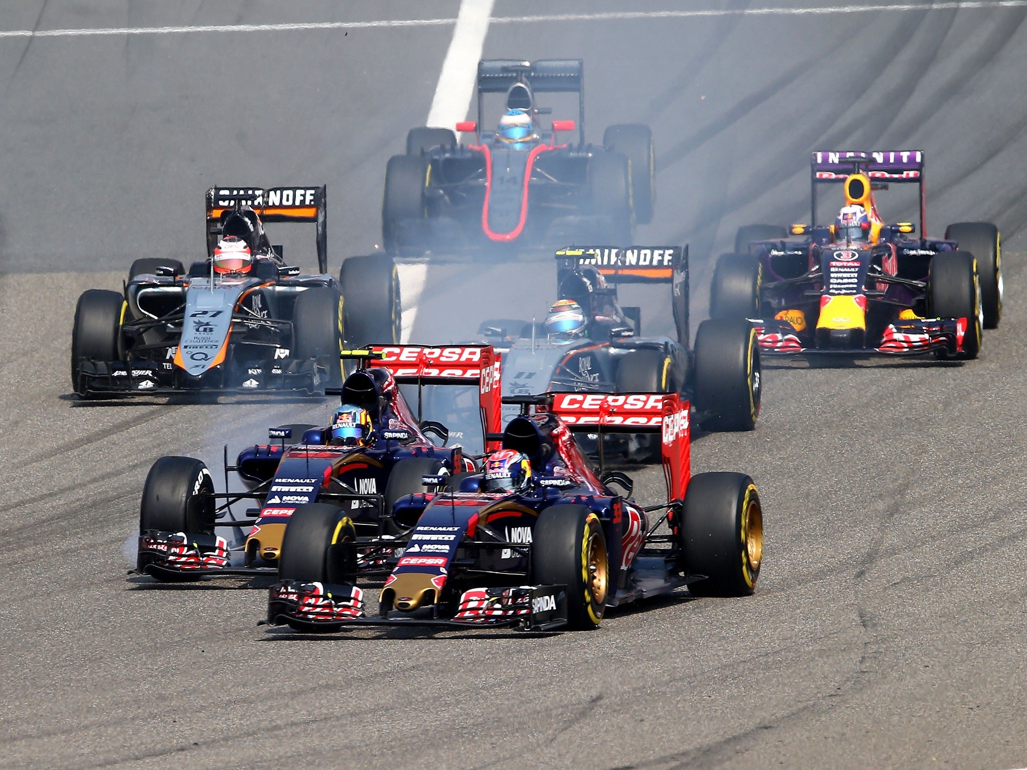 The Toro Rosso pair of Max Verstappen and Carlos Sianz Jr jostle for position