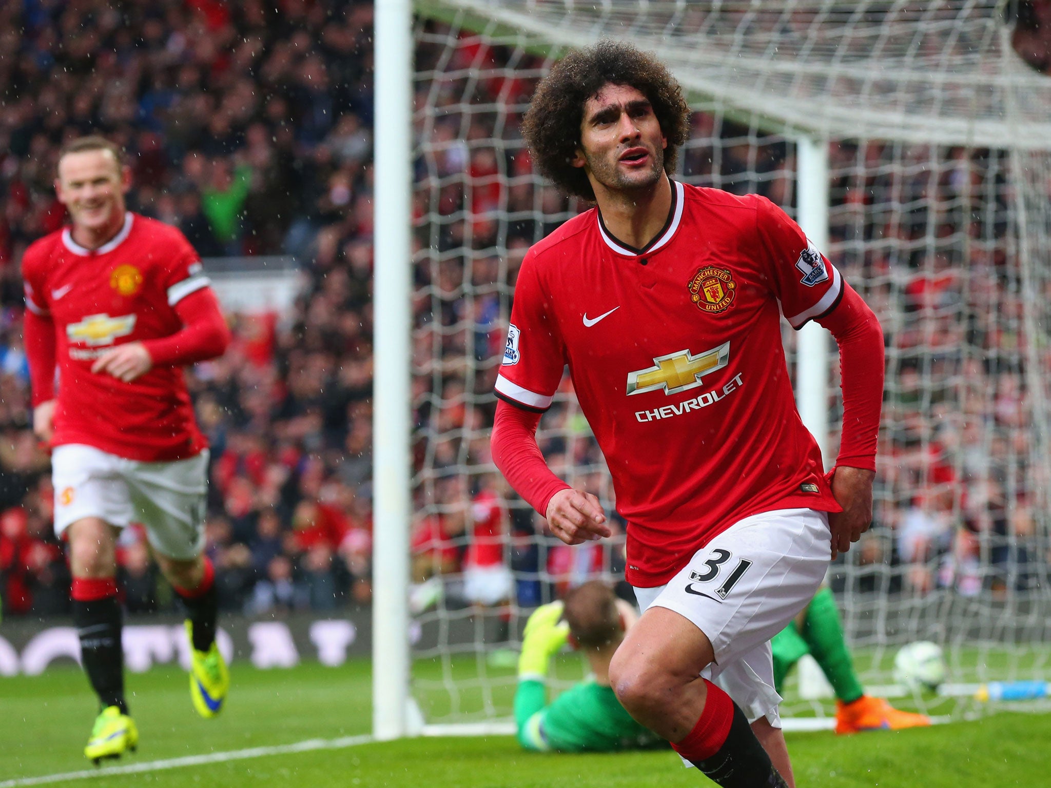 Fellaini celebrates scoring at the weekend